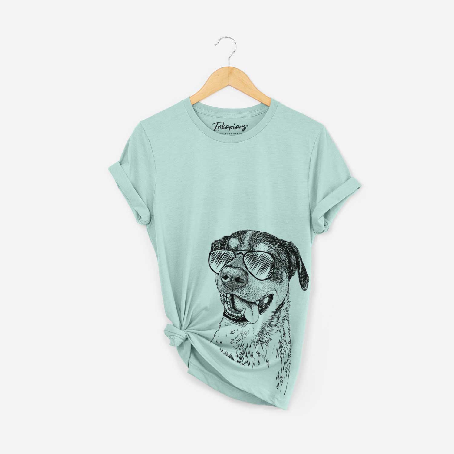 Hand-drawn sketch of Gerti the Mixed Breed wearing aviator sunglasses on a Heather Sage Bella Canvas Unisex Crewneck