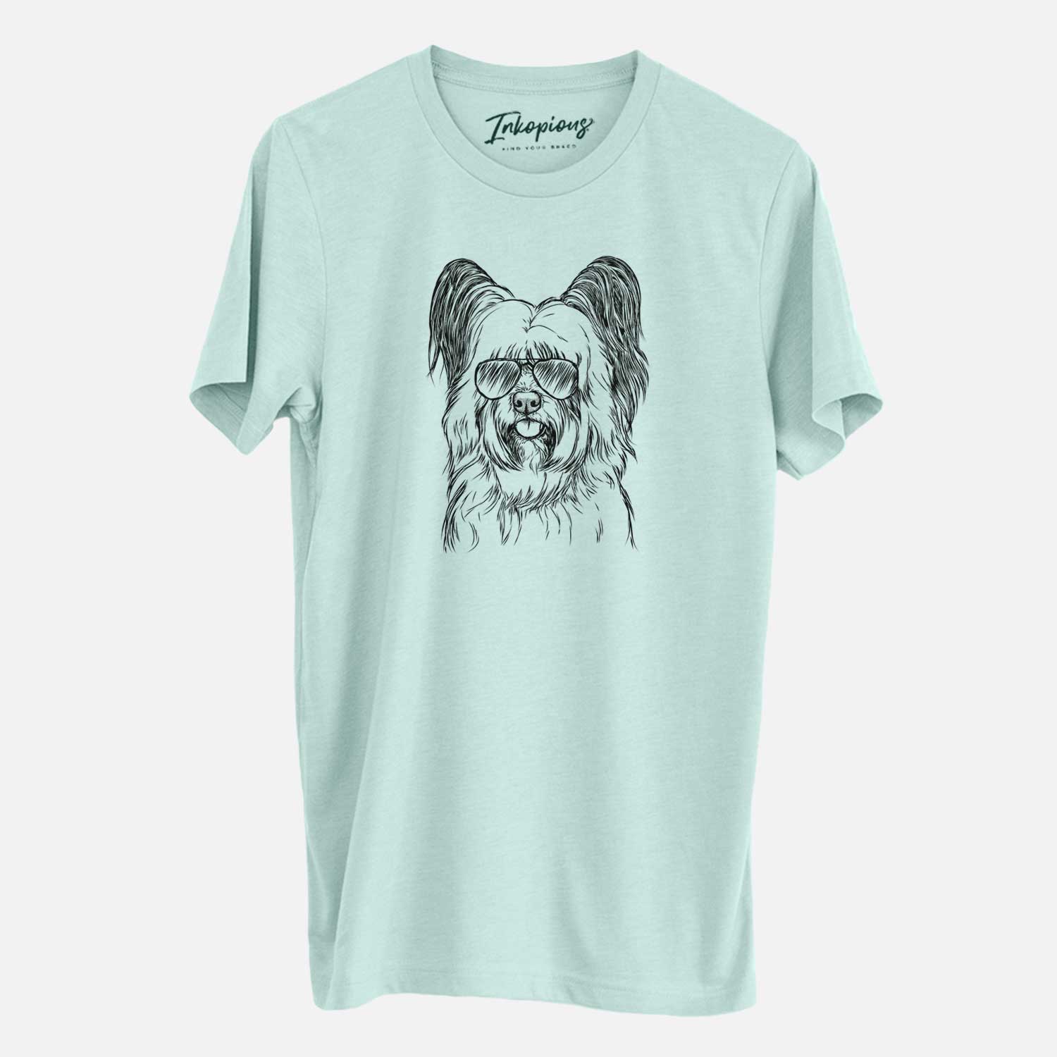 Hand-drawn sketch of Gideon the Skye Terrier wearing aviator sunglasses on a Heather Sage Unisex crewneck