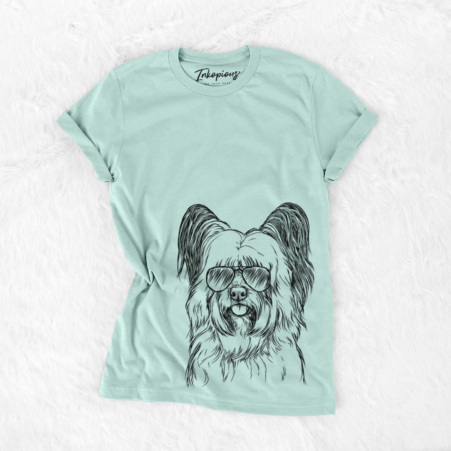 Hand-drawn sketch of Gideon the Skye Terrier wearing aviator sunglasses on a Heather Sage Unisex crewneck