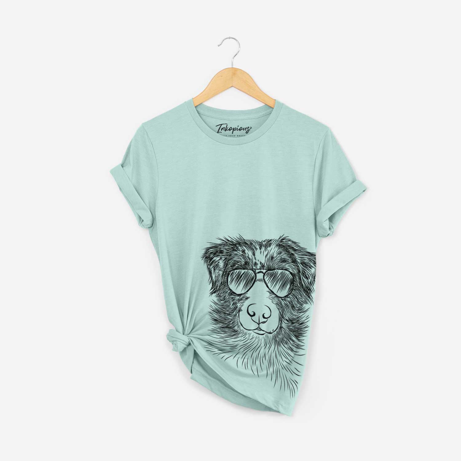 Hand-drawn sketch of Gram the Australian Shepherd wearing aviator sunglasses on a Heather Sage Bella Canvas Unisex Crewneck