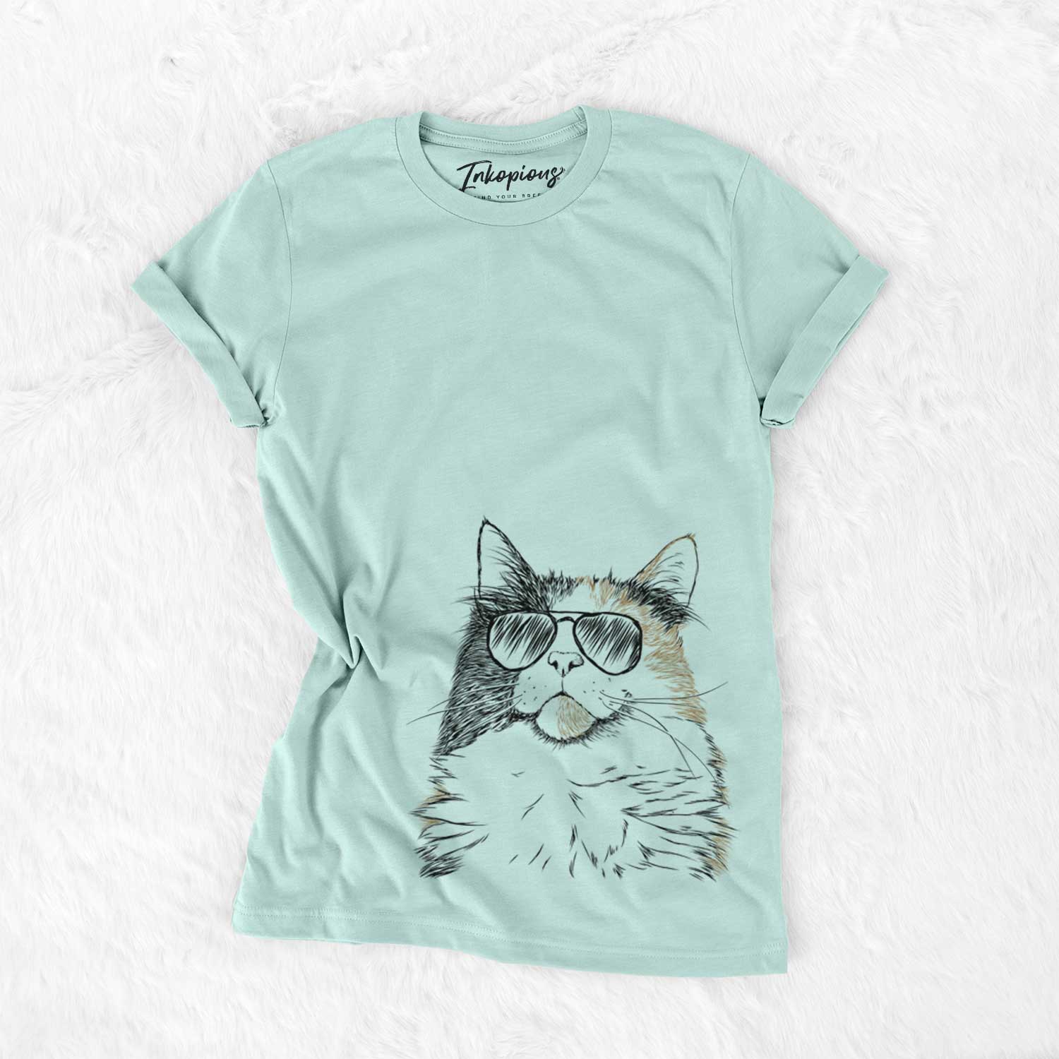 Hand-drawn sketch of Greta the Calico Cat wearing aviator sunglasses on a Heather Sage Unisex crewneck