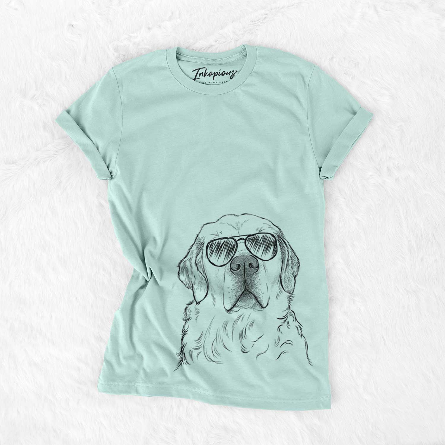 Hand-drawn sketch of Hank the Irish Cream Golden Retriever wearing aviator sunglasses on a Heather Sage Unisex crewneck