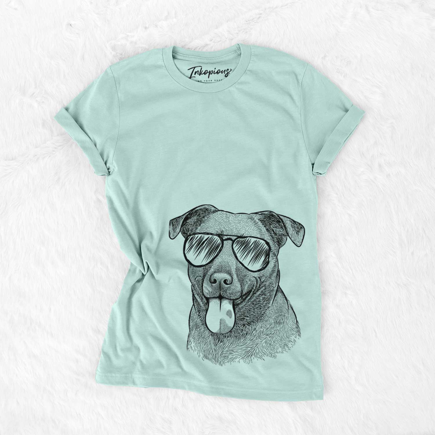 Hand-drawn sketch of Harbor the Mixed Breed wearing aviator sunglasses on a Heather Sage Unisex crewneck