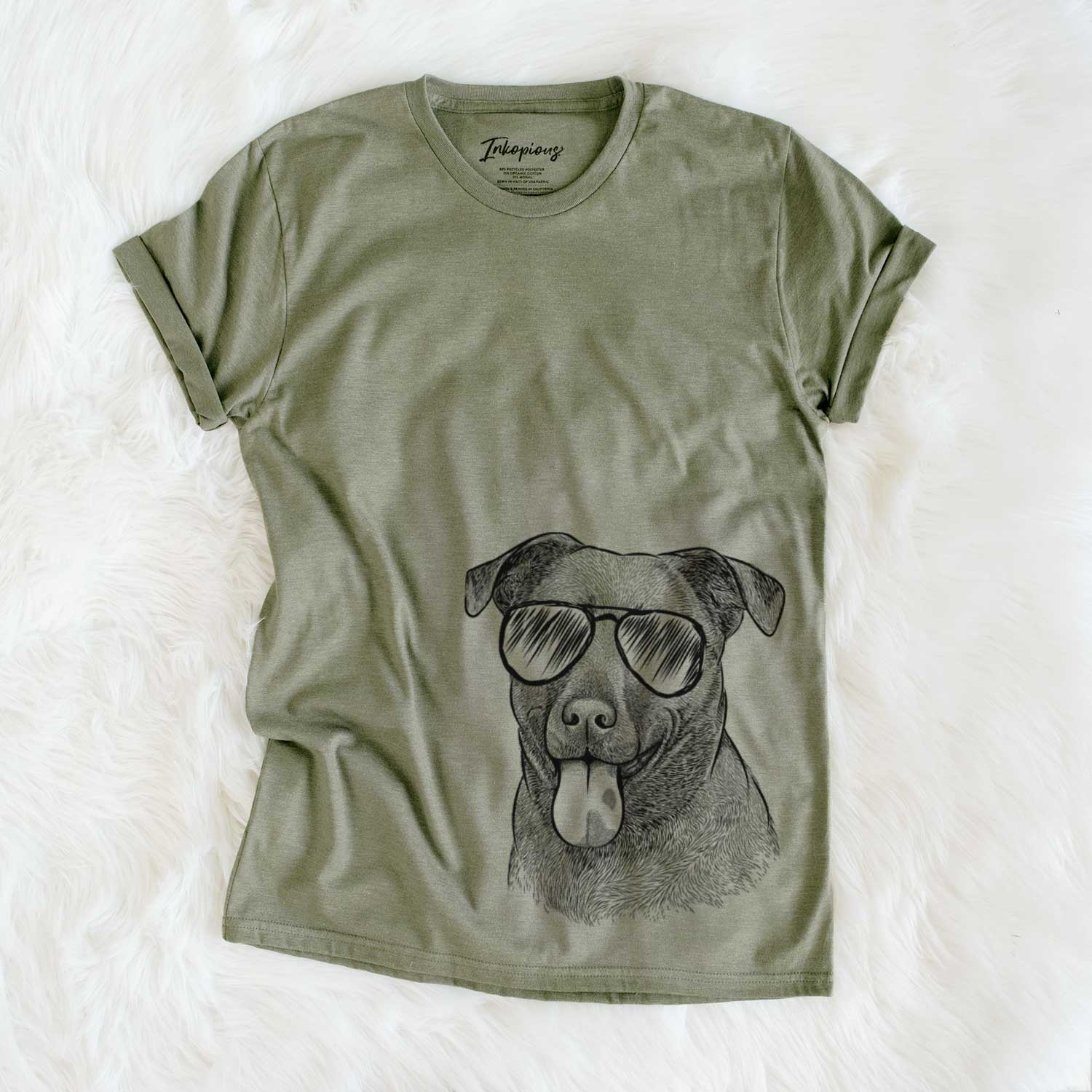 Hand-drawn sketch of Harbor the Mixed Breed wearing aviator sunglasses on an Olive Unisex crewneck