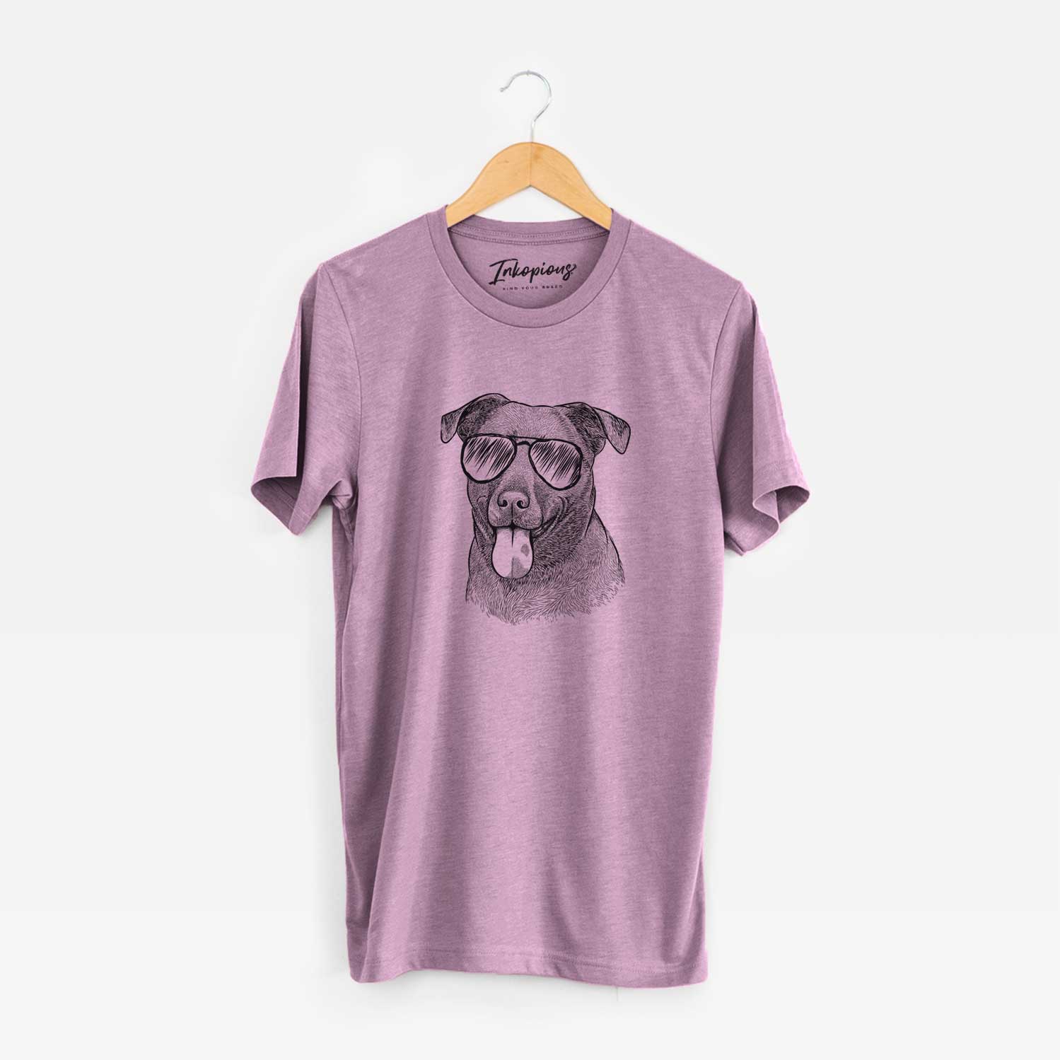 Hand-drawn sketch of Harbor the Mixed Breed wearing aviator sunglasses on an Orchid Unisex crewneck