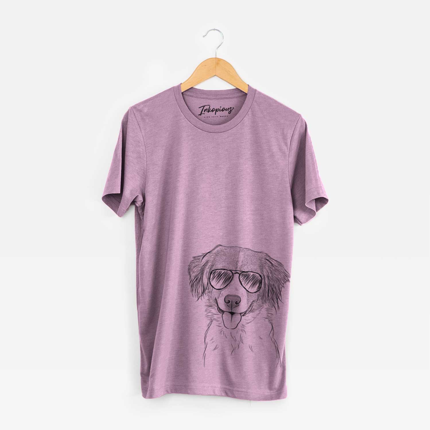 Hand-drawn sketch of Hercules the Nederlandse Kooikerhondje wearing aviator sunglasses on an Orchid Bella Canvas Unisex Crewneck