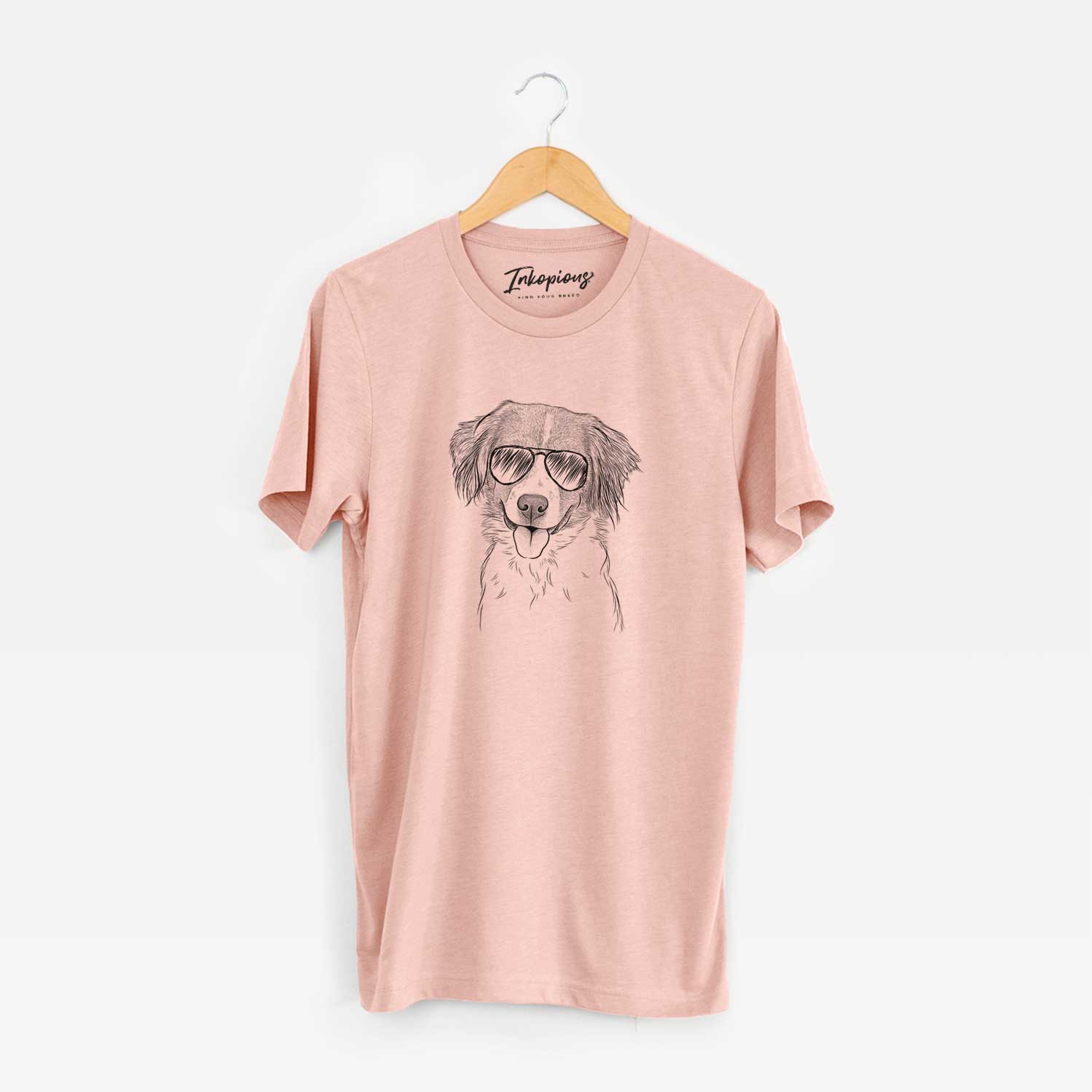 Hand-drawn sketch of Hercules the Nederlandse Kooikerhondje wearing aviator sunglasses on a Peach Unisex crewneck
