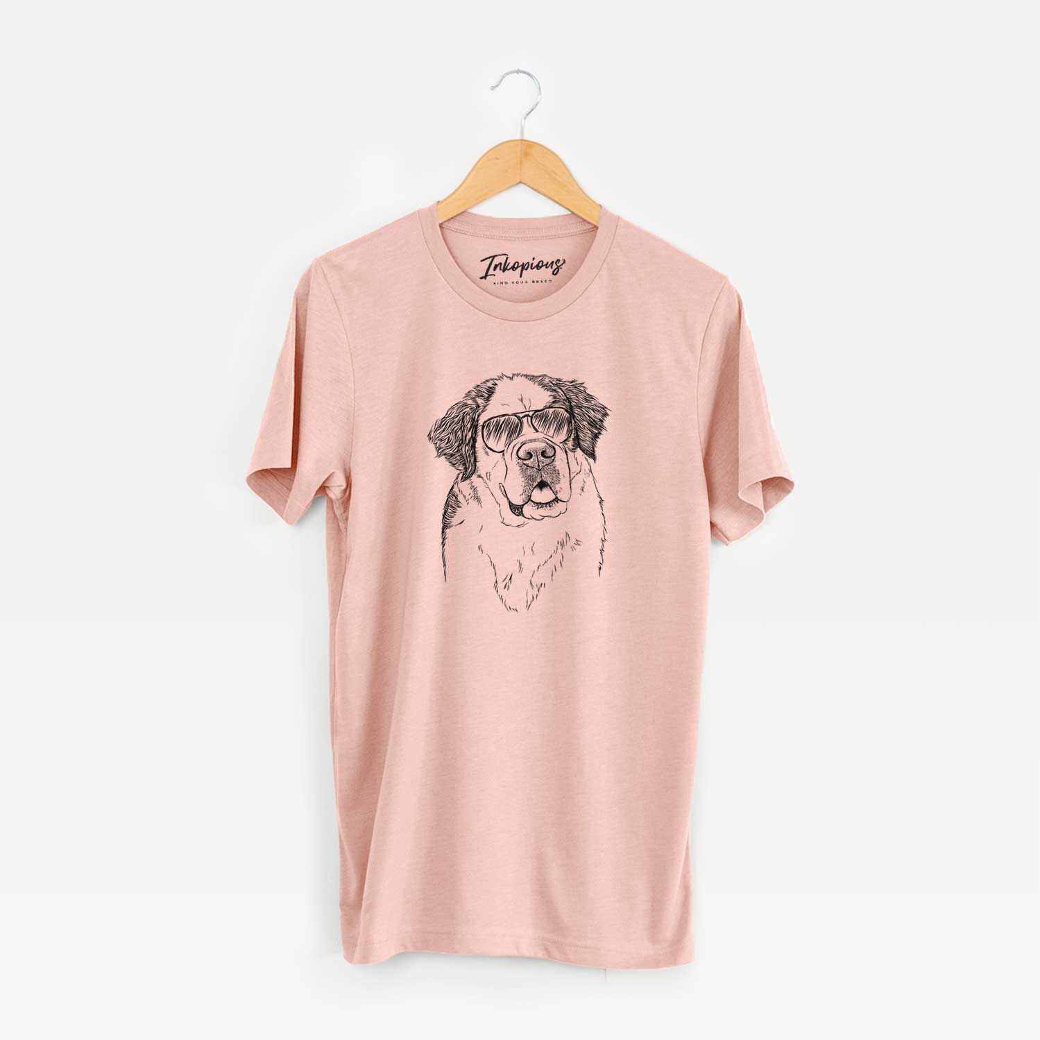 Hand-drawn sketch of Hook the Saint Bernard wearing aviator sunglasses on a Peach Unisex crewneck