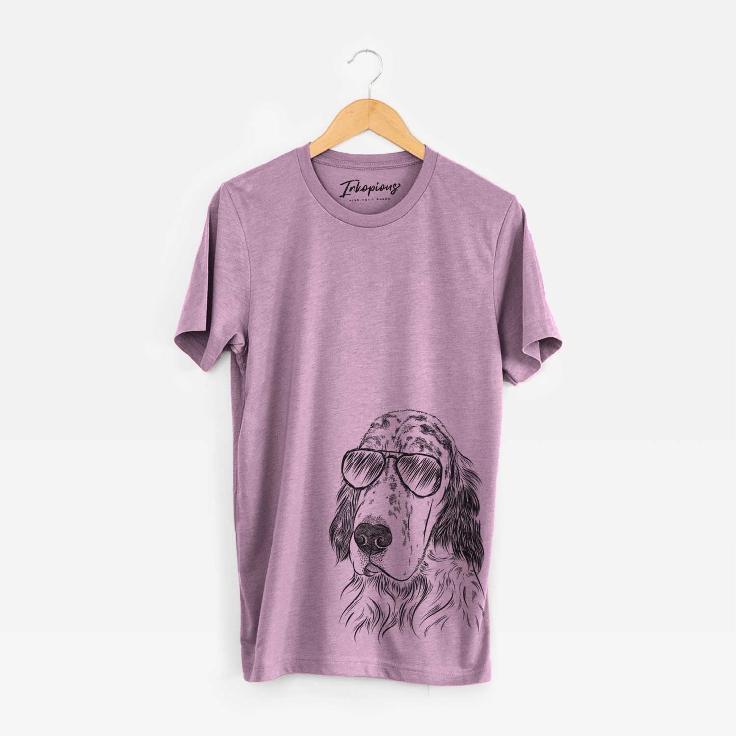 Hand-drawn sketch of Hutch the English Setter wearing aviator sunglasses on an Orchid Unisex crewneck