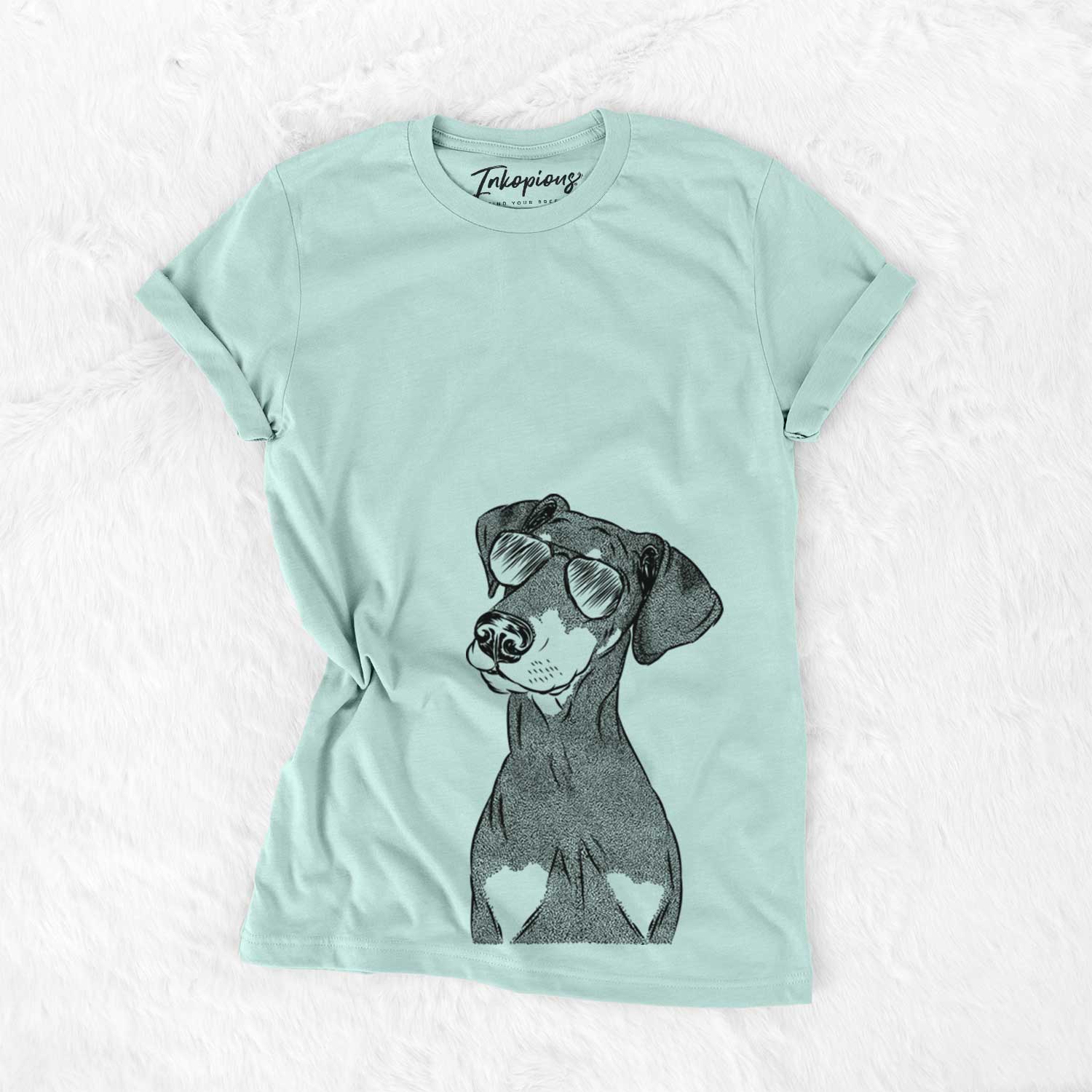 Hand-drawn sketch of Iroh the Doberman Pinscher wearing aviator sunglasses on a Heather Sage Unisex crewneck