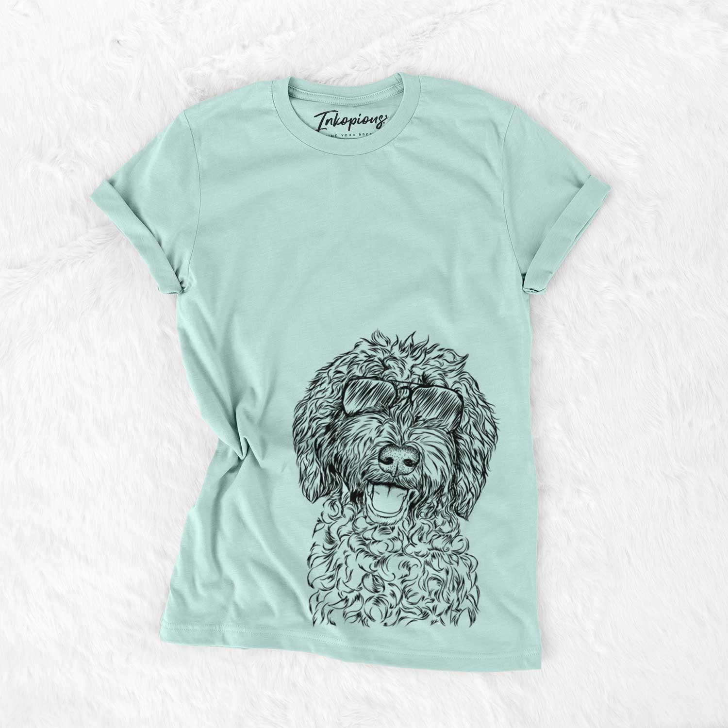 Hand-drawn sketch of Jack the Chocolate Labradoodle wearing aviator sunglasses on a Heather Sage Unisex crewneck