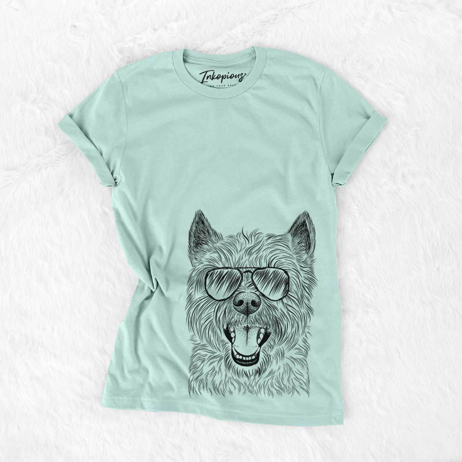 Hand-drawn sketch of Jeff the Cairn Terrier wearing aviator sunglasses on a Heather Sage Unisex crewneck
