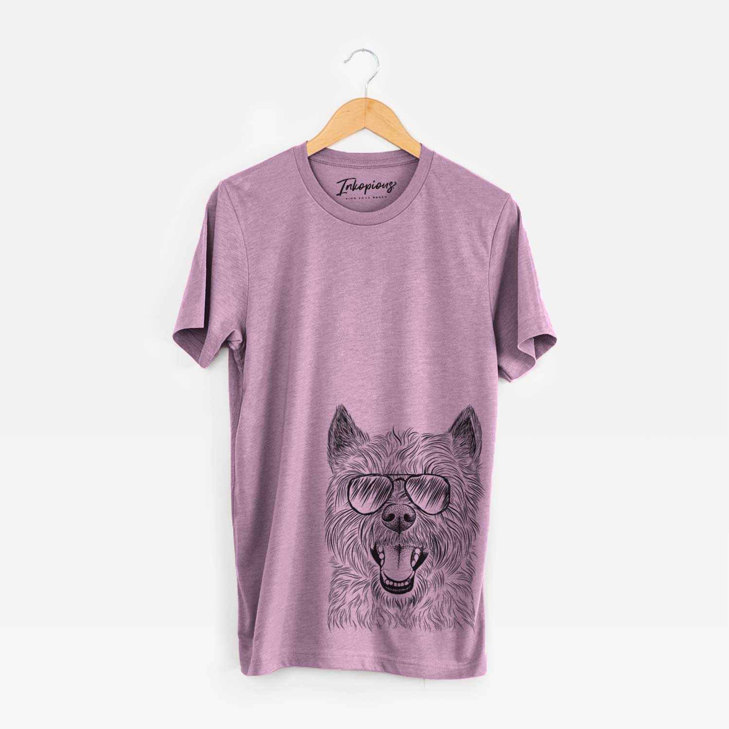 Hand-drawn sketch of Jeff the Cairn Terrier wearing aviator sunglasses on an Orchid Unisex crewneck
