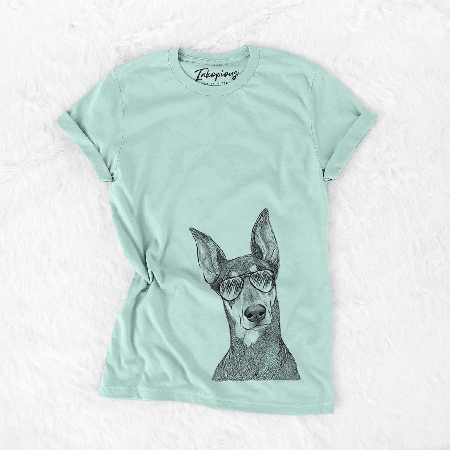 Hand-drawn sketch of Jenna the Doberman Pinscher wearing aviator sunglasses on a Heather Sage Unisex crewneck