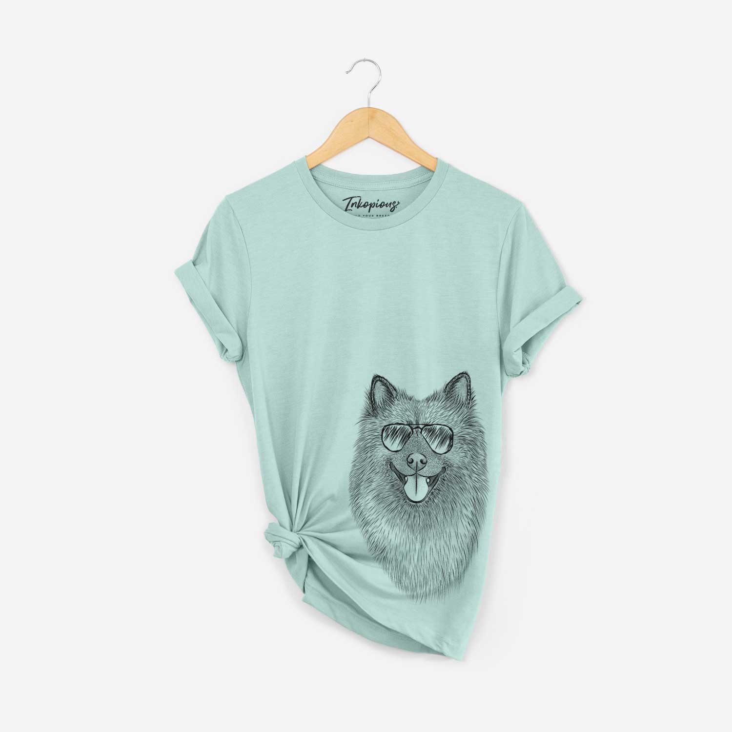 Hand-drawn sketch of Kai the Keeshond wearing aviator sunglasses on a Heather Sage Bella Canvas Unisex Crewneck