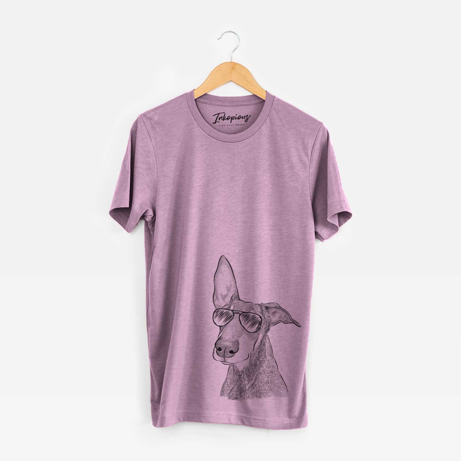 Hand-drawn sketch of Kain the Doberman Pinscher wearing aviator sunglasses on an Orchid Bella Canvas Unisex Crewneck