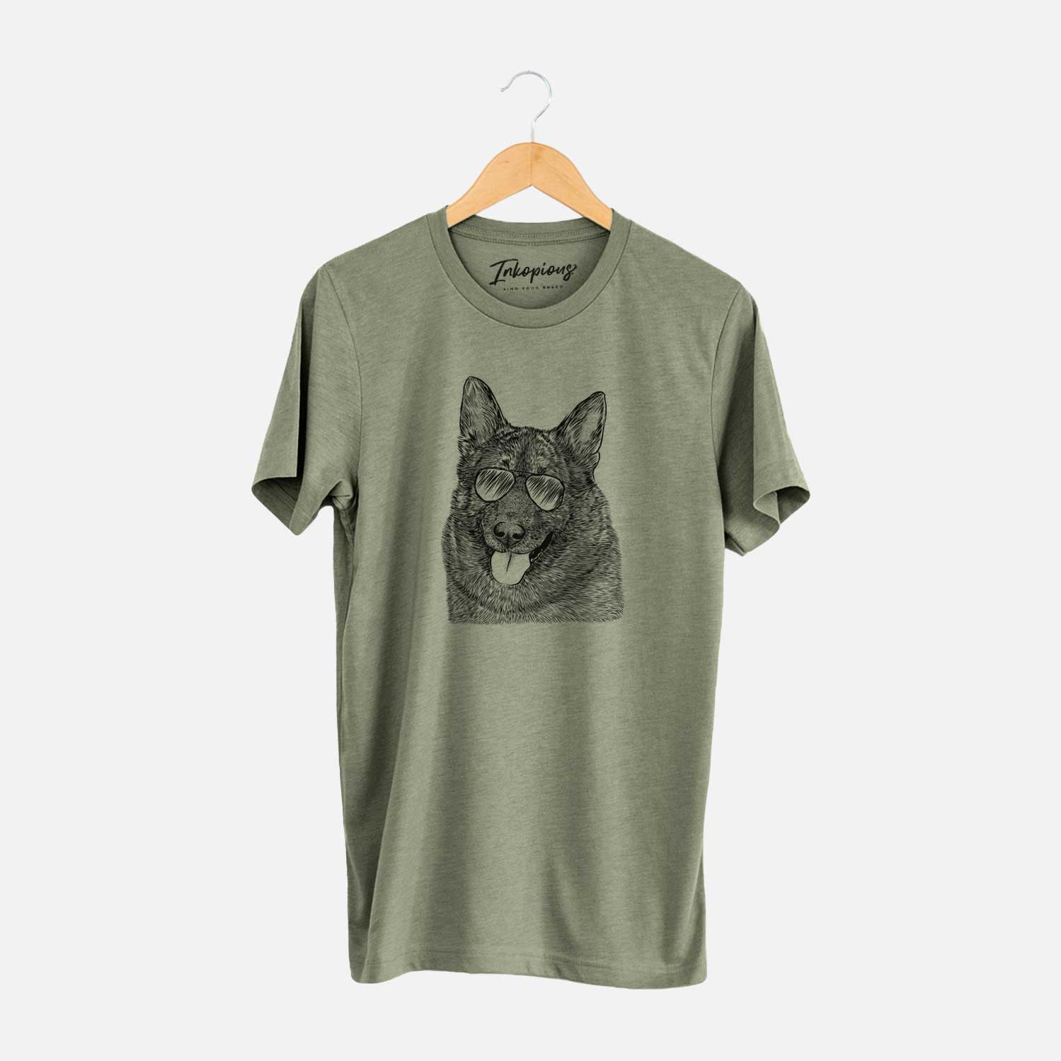 Hand-drawn sketch of Kasia the Norwegian Elkhound wearing aviator sunglasses on an Olive Unisex crewneck