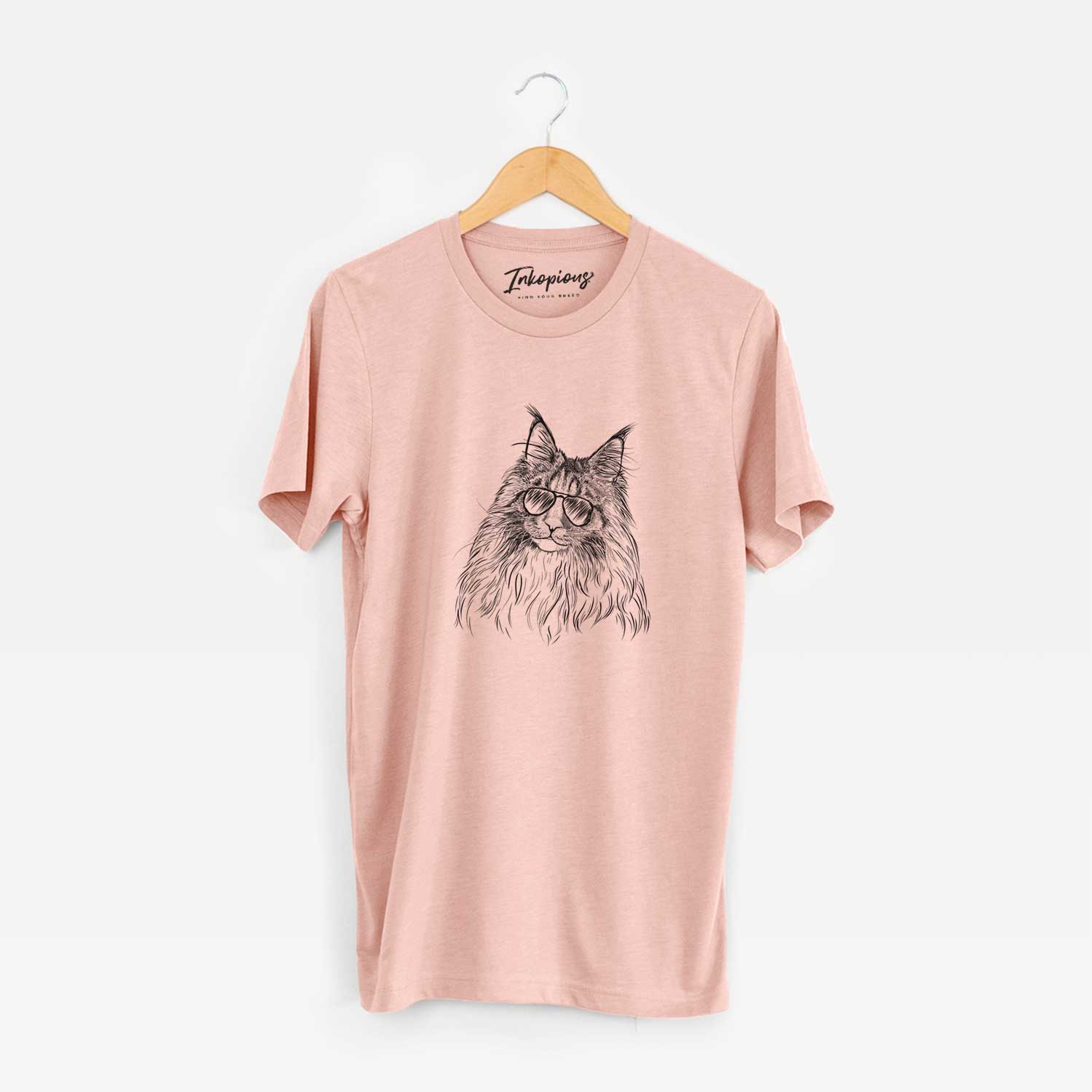 Hand-drawn sketch of Kiki the Maine Coon Cat wearing aviator sunglasses on a Peach Unisex crewneck