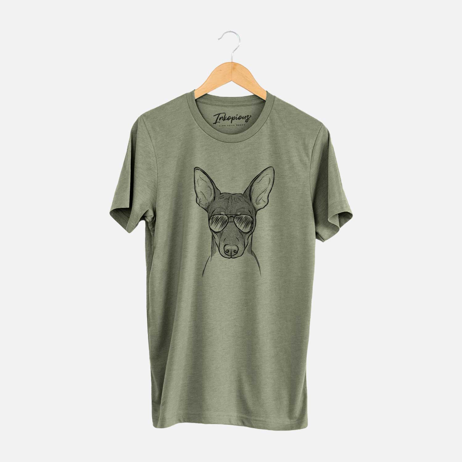 Hand-drawn sketch of Knox the Rat Terrier wearing aviator sunglasses on an Olive Unisex crewneck