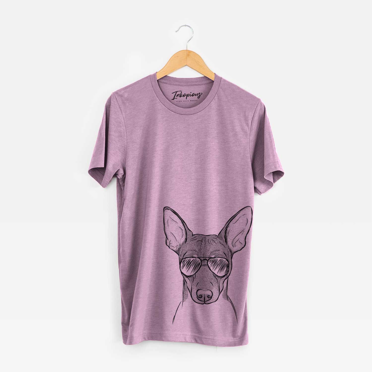 Hand-drawn sketch of Knox the Rat Terrier wearing aviator sunglasses on an Orchid Bella Canvas Unisex Crewneck