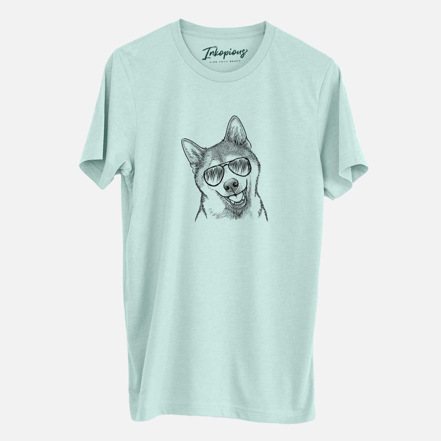 Hand-drawn sketch of Koby the Shiba Inu wearing aviator sunglasses on a Heather Sage Unisex crewneck