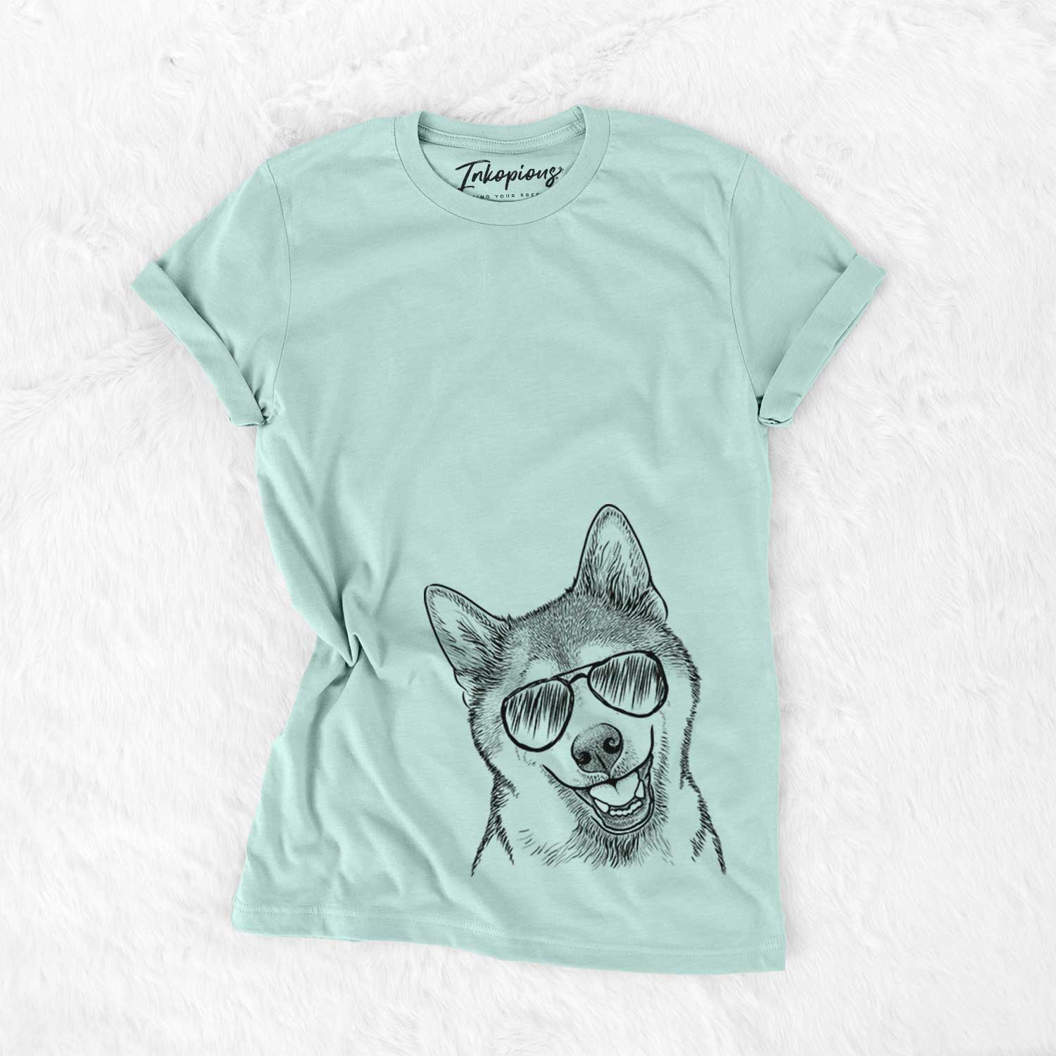 Hand-drawn sketch of Koby the Shiba Inu wearing aviator sunglasses on a Heather Sage Unisex crewneck