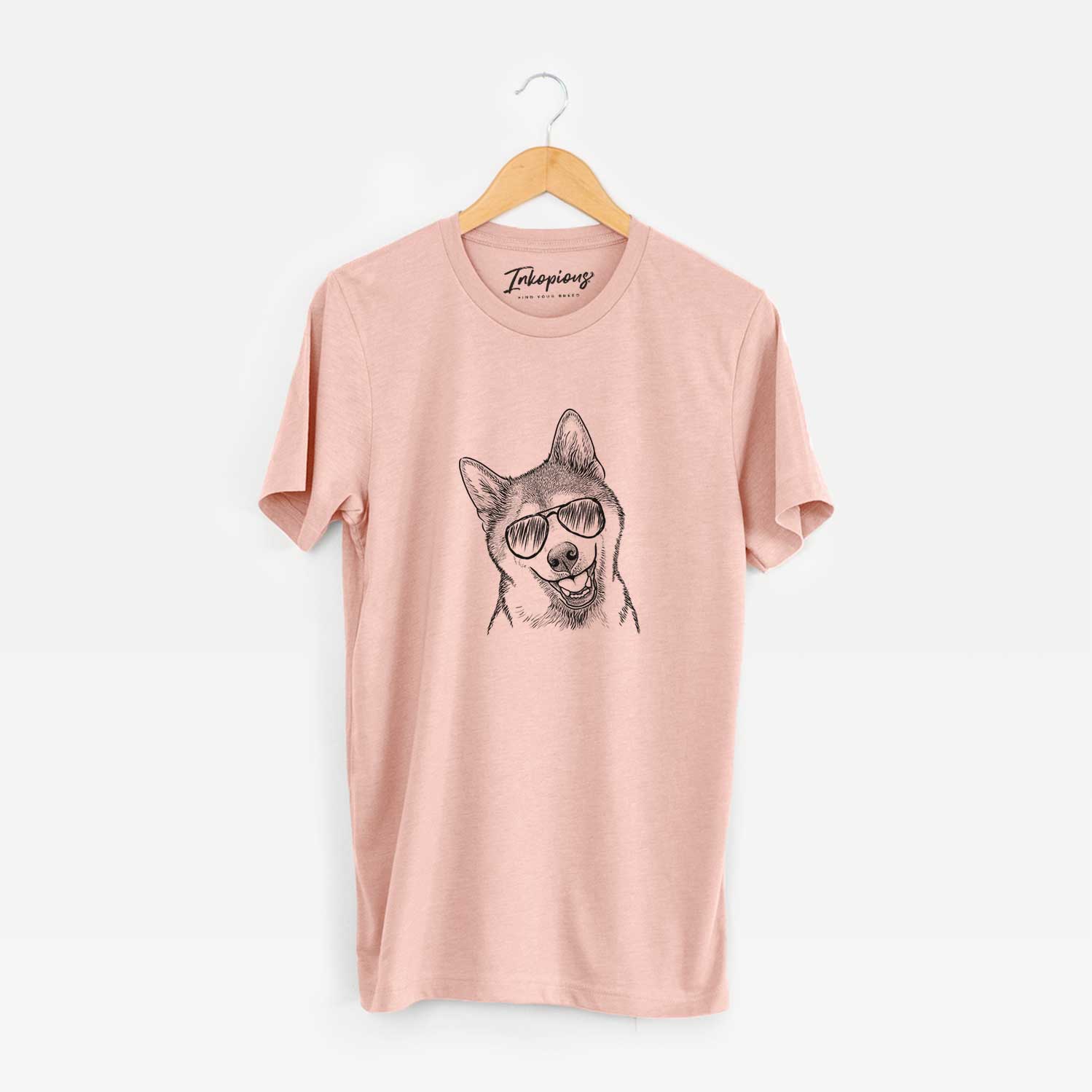 Hand-drawn sketch of Koby the Shiba Inu wearing aviator sunglasses on a Peach Unisex crewneck