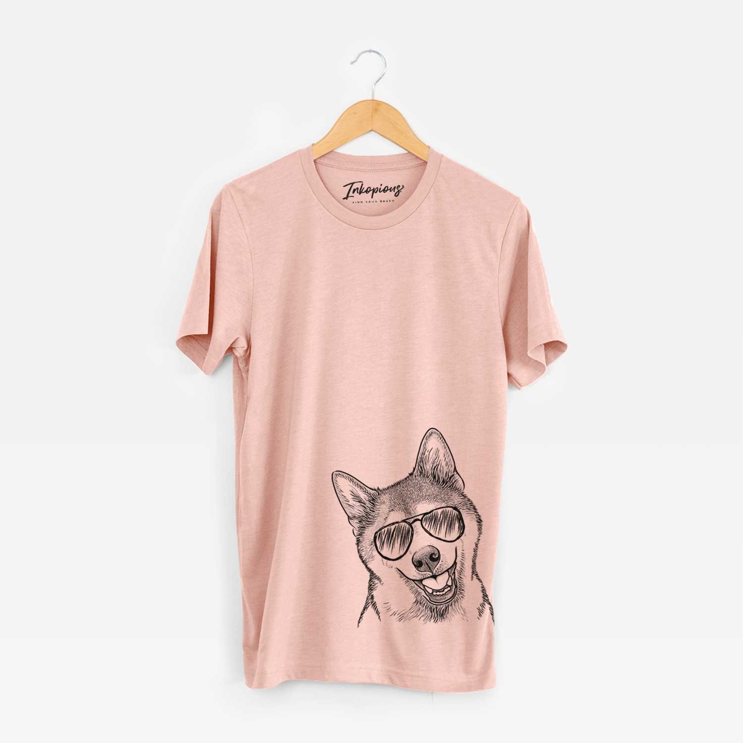 Hand-drawn sketch of Koby the Shiba Inu wearing aviator sunglasses on a Peach Unisex crewneck