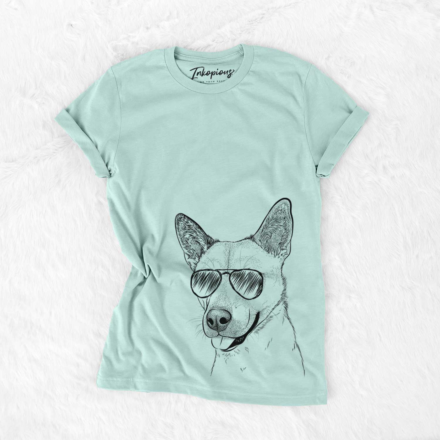 Hand-drawn sketch of Kulfi the Jindo Shiba Inu Mix wearing aviator sunglasses on a Heather Sage Unisex crewneck
