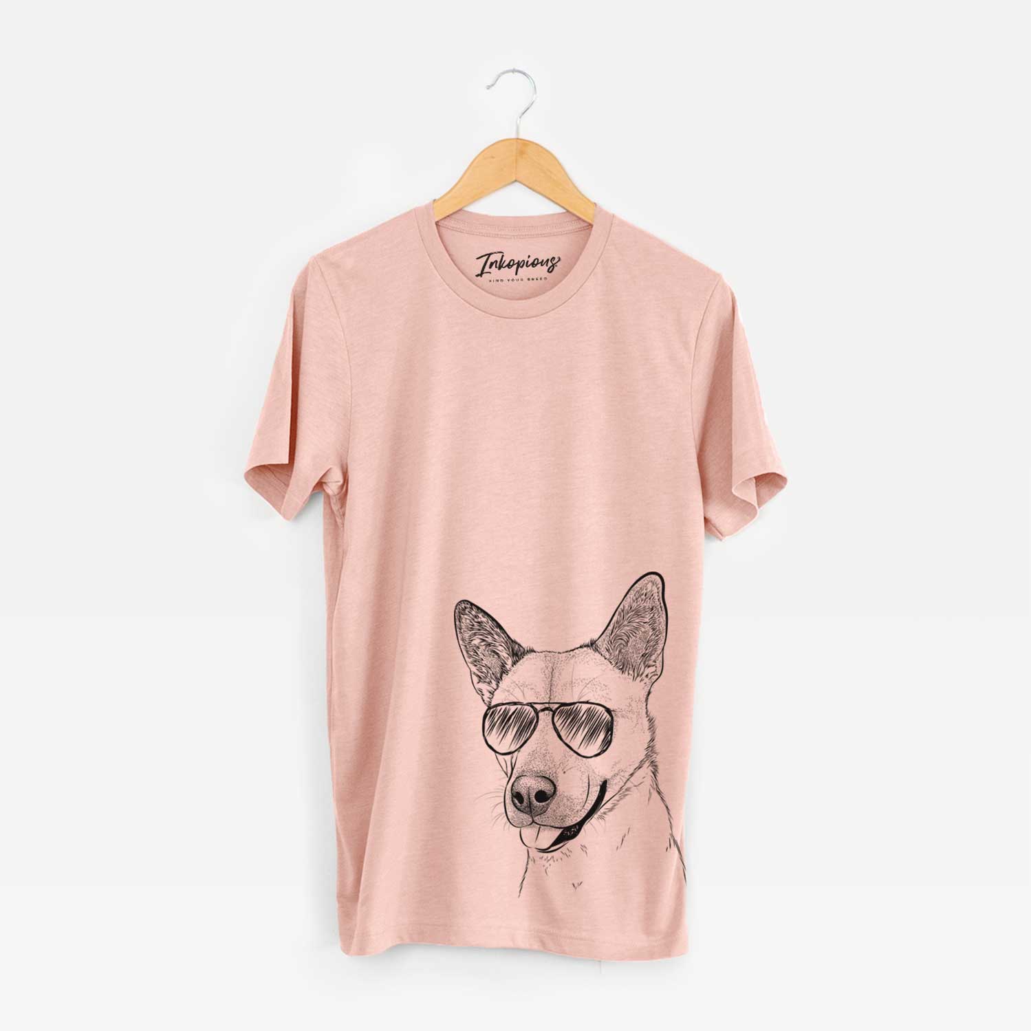 Hand-drawn sketch of Kulfi the Jindo Shiba Inu Mix wearing aviator sunglasses on a Peach Unisex crewneck
