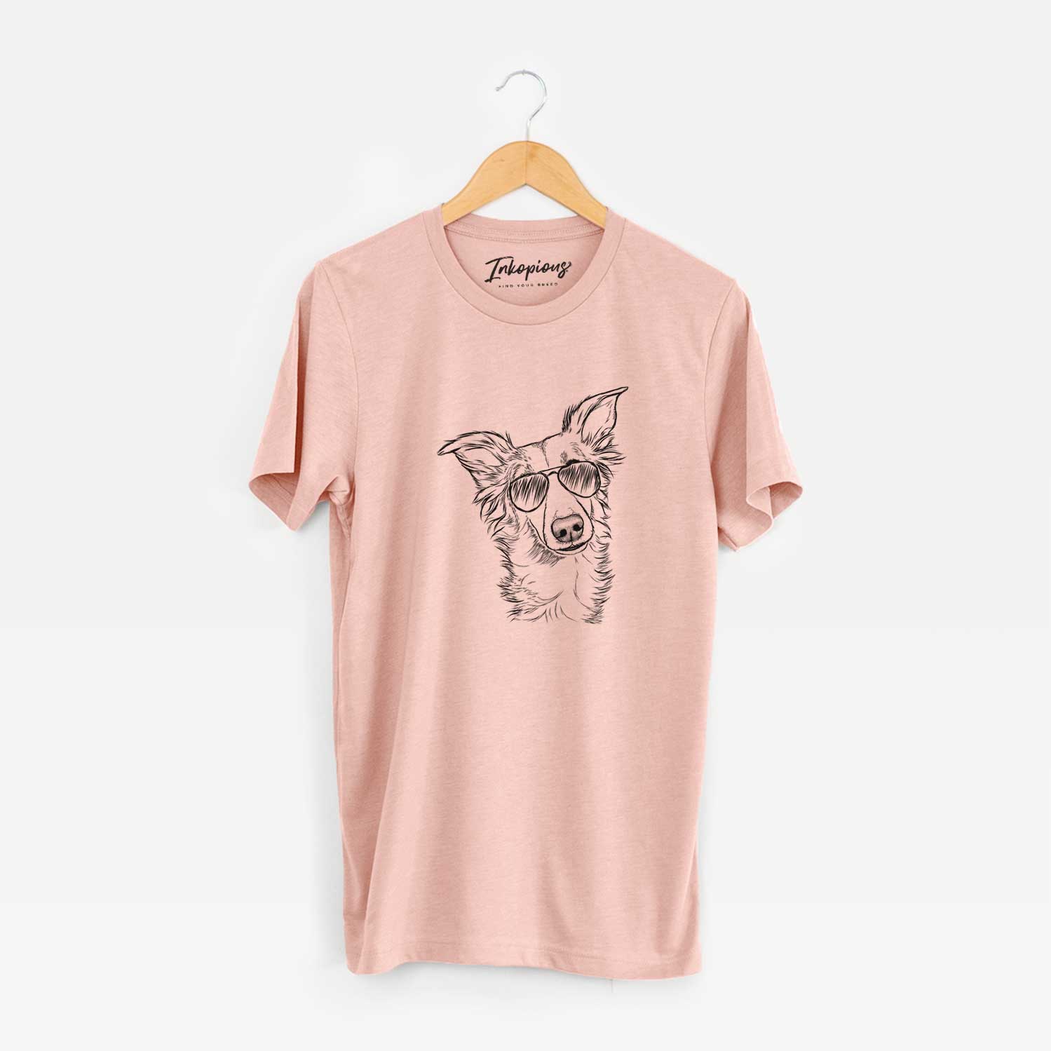 Hand-drawn sketch of Kyu the Windsprite wearing aviator sunglasses on a Peach Unisex crewneck