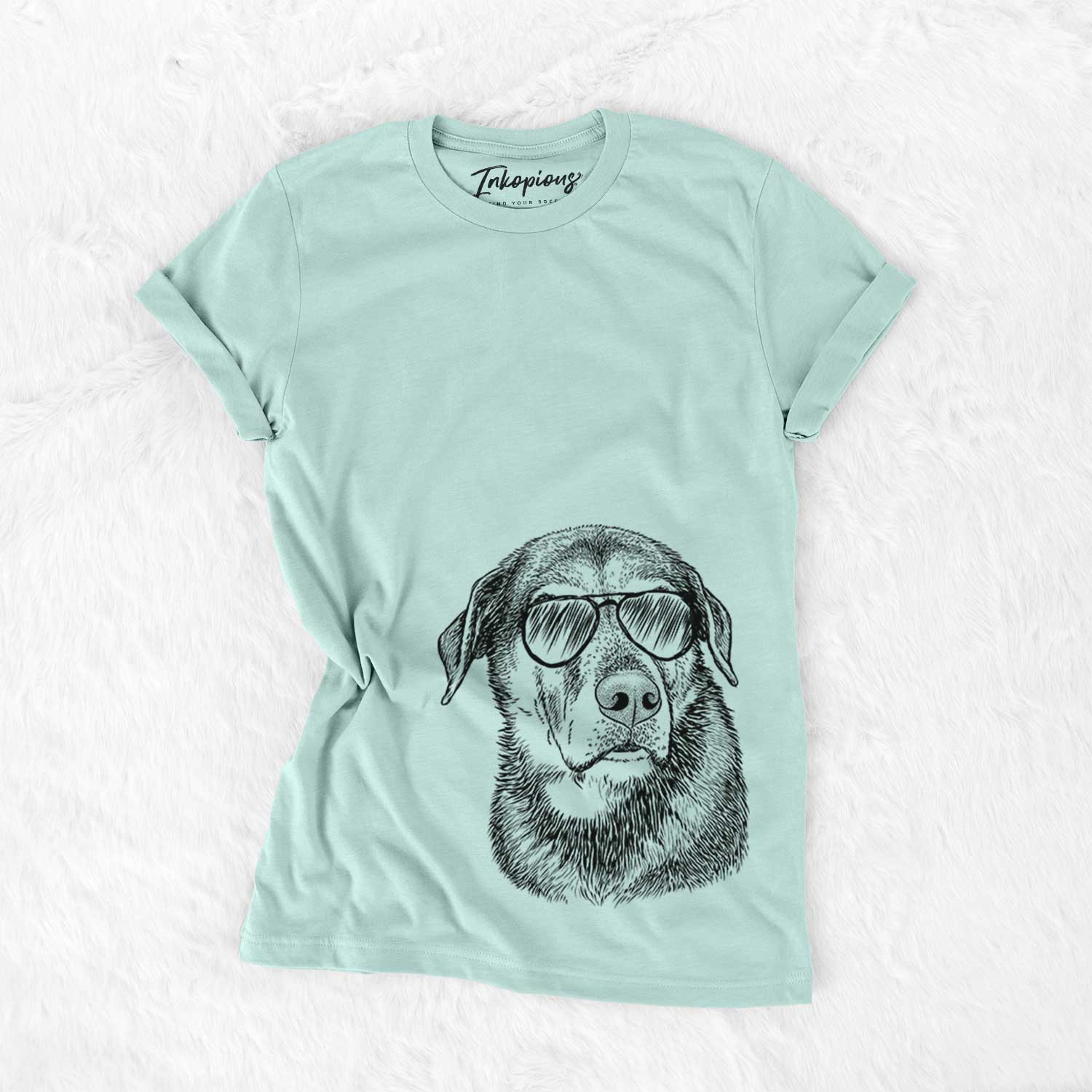 Hand-drawn sketch of Lobo the Shepherd Mix wearing aviator sunglasses on a Heather Sage Unisex crewneck