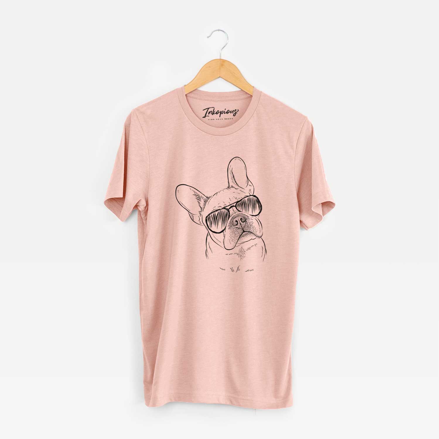 Hand-drawn sketch of Loki the French Bulldog wearing aviator sunglasses on a Peach Unisex crewneck