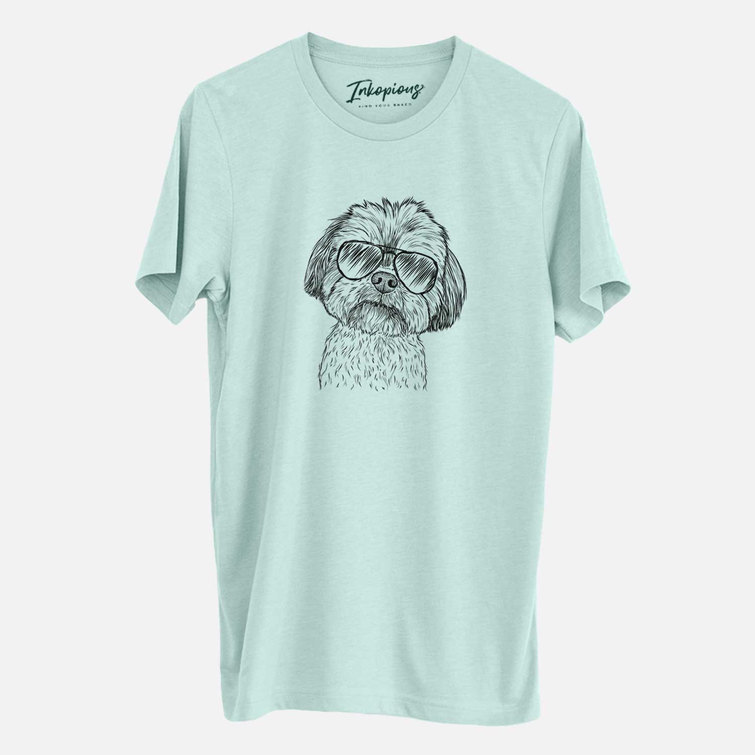 Hand-drawn sketch of Lucy the Shorkie wearing aviator sunglasses on a Heather Sage Unisex crewneck