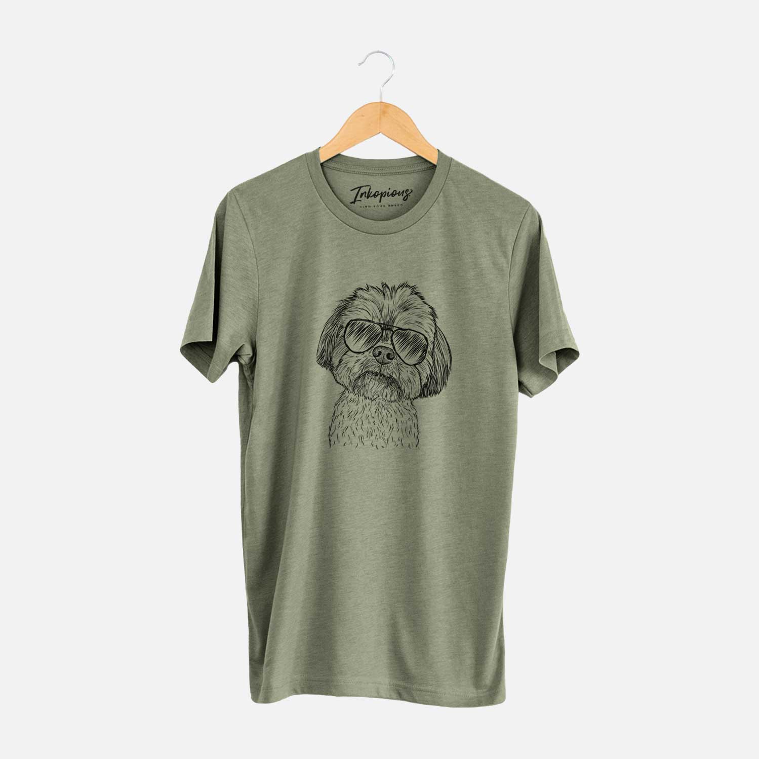Hand-drawn sketch of Lucy the Shorkie wearing aviator sunglasses on an Olive Unisex crewneck