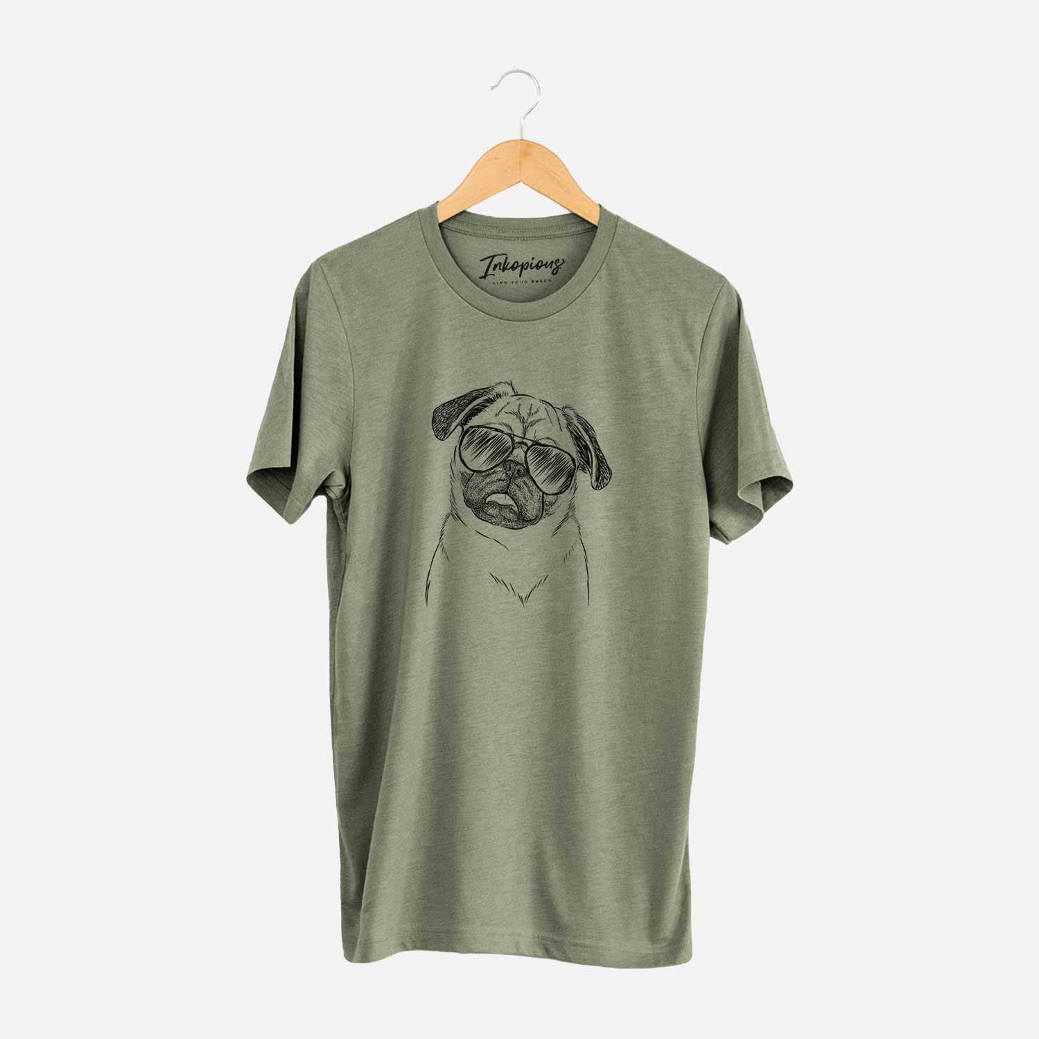 Hand-drawn sketch of Macy the Pug wearing aviator sunglasses on an Olive Unisex crewneck