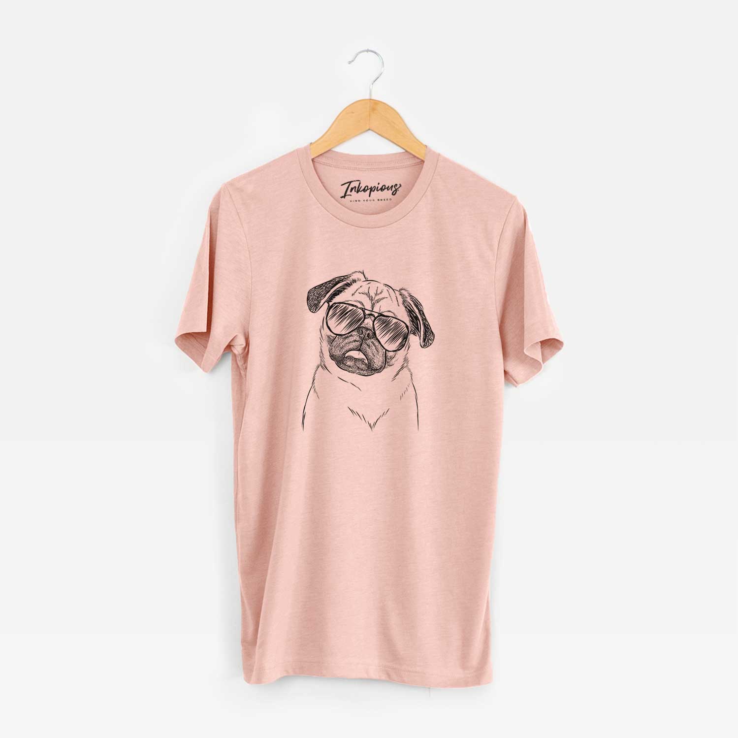 Hand-drawn sketch of Macy the Pug wearing aviator sunglasses on a Peach Unisex crewneck