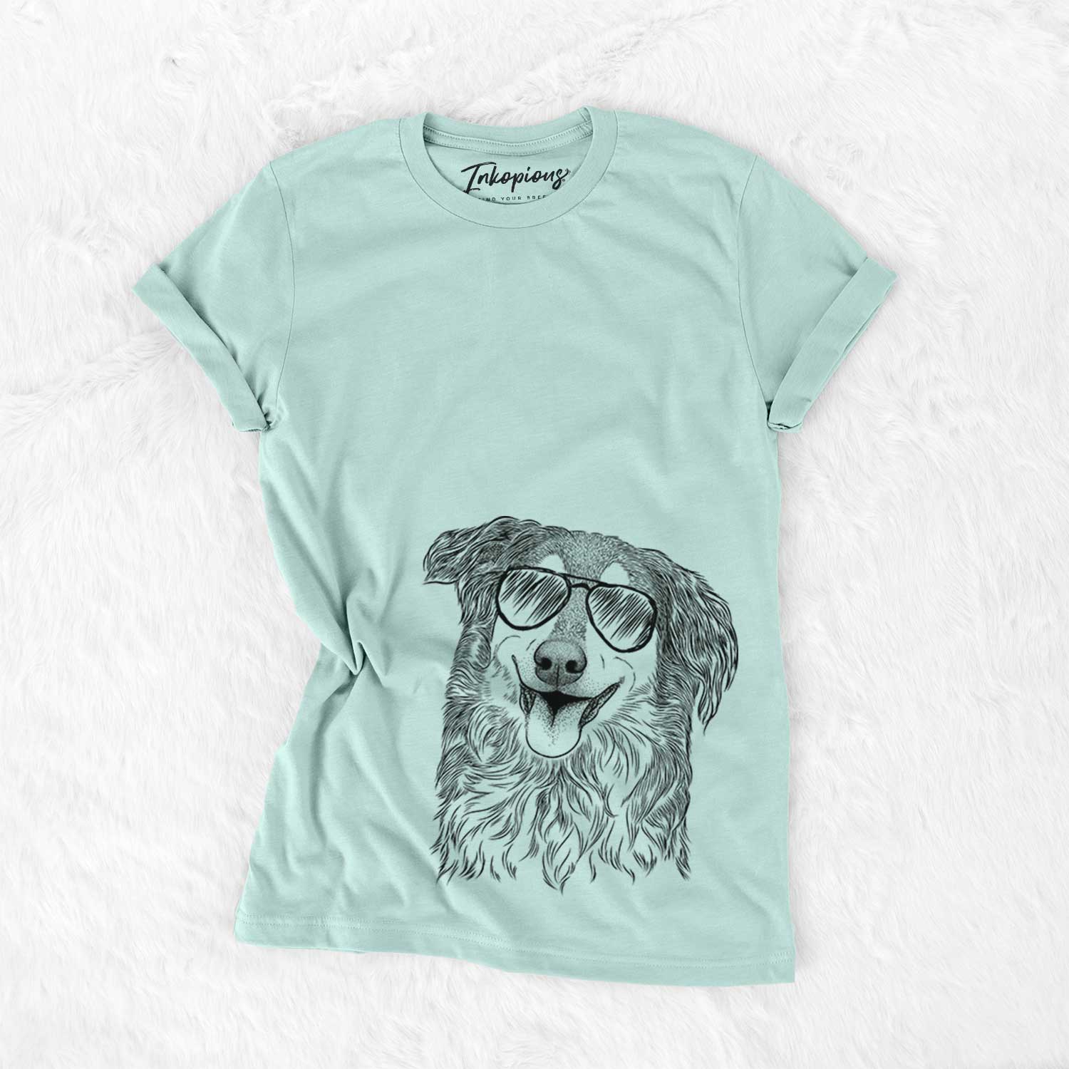 Hand-drawn sketch of Maddie the English Shepherd wearing aviator sunglasses on a Heather Sage Unisex crewneck