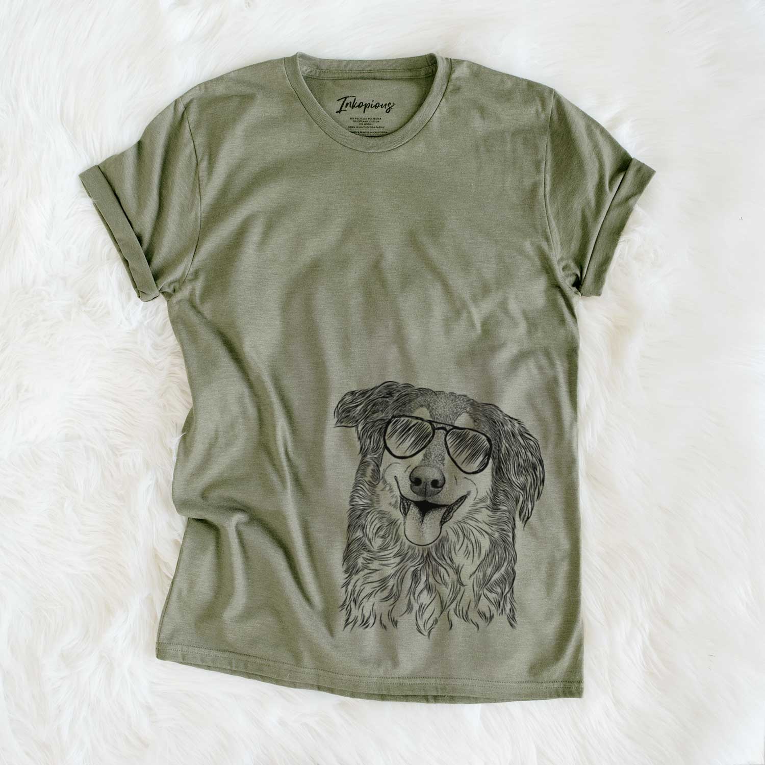 Hand-drawn sketch of Maddie the English Shepherd wearing aviator sunglasses on an Olive Unisex crewneck