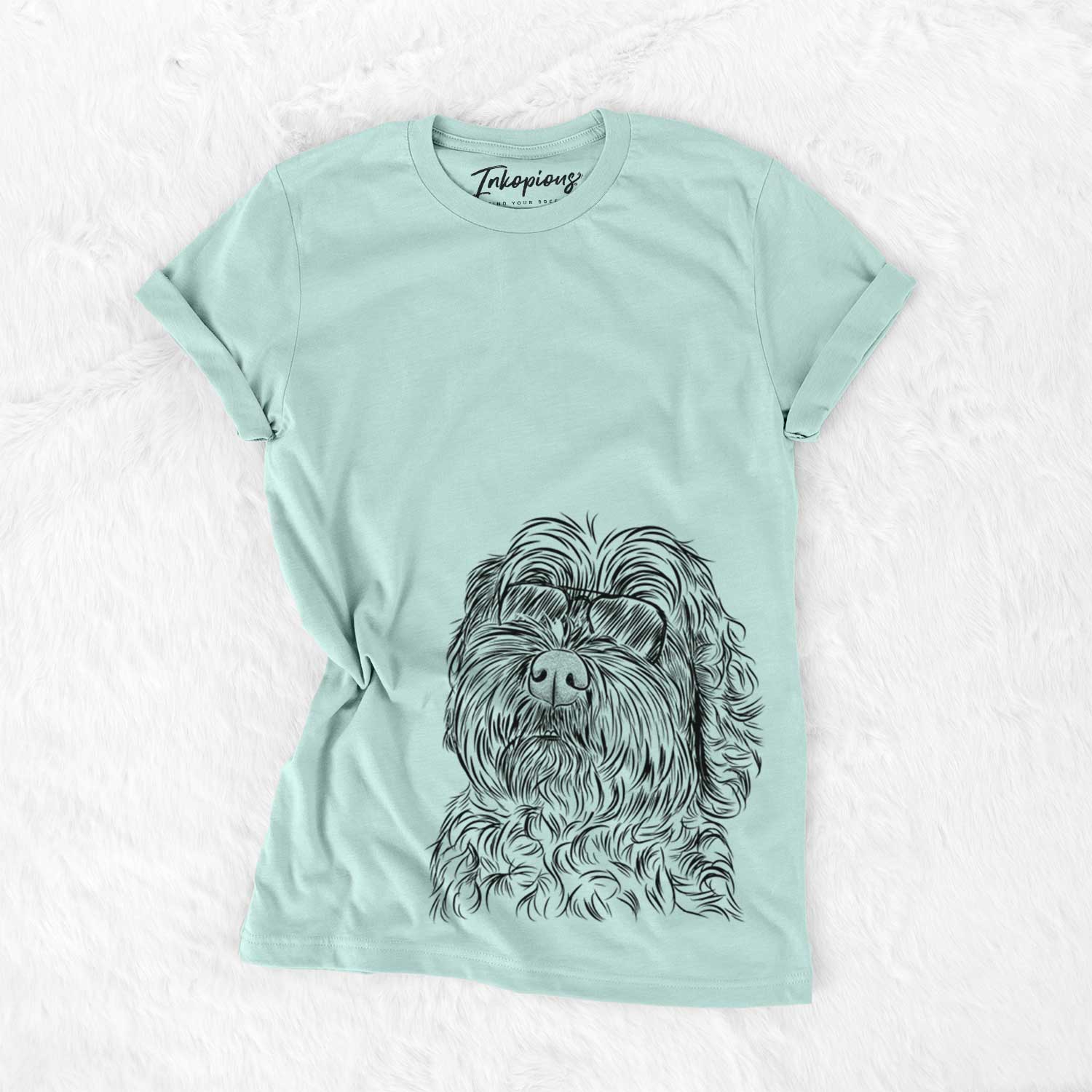 Hand-drawn sketch of Maggie Girl the Cockapoo wearing aviator sunglasses on a Heather Sage Unisex crewneck