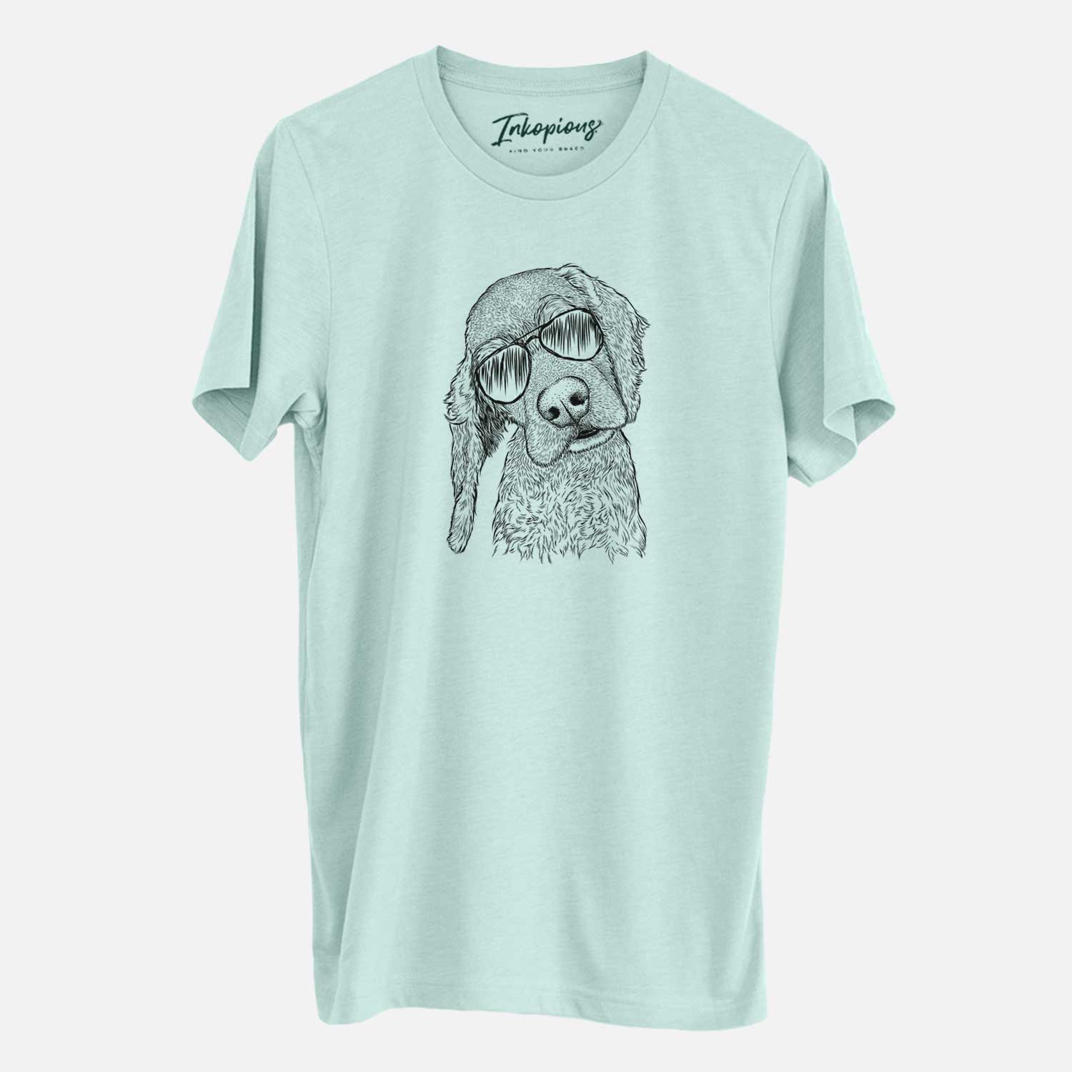 Hand-drawn sketch of Mambo #5 the Cocker Spaniel wearing aviator sunglasses on a Heather Sage Unisex crewneck