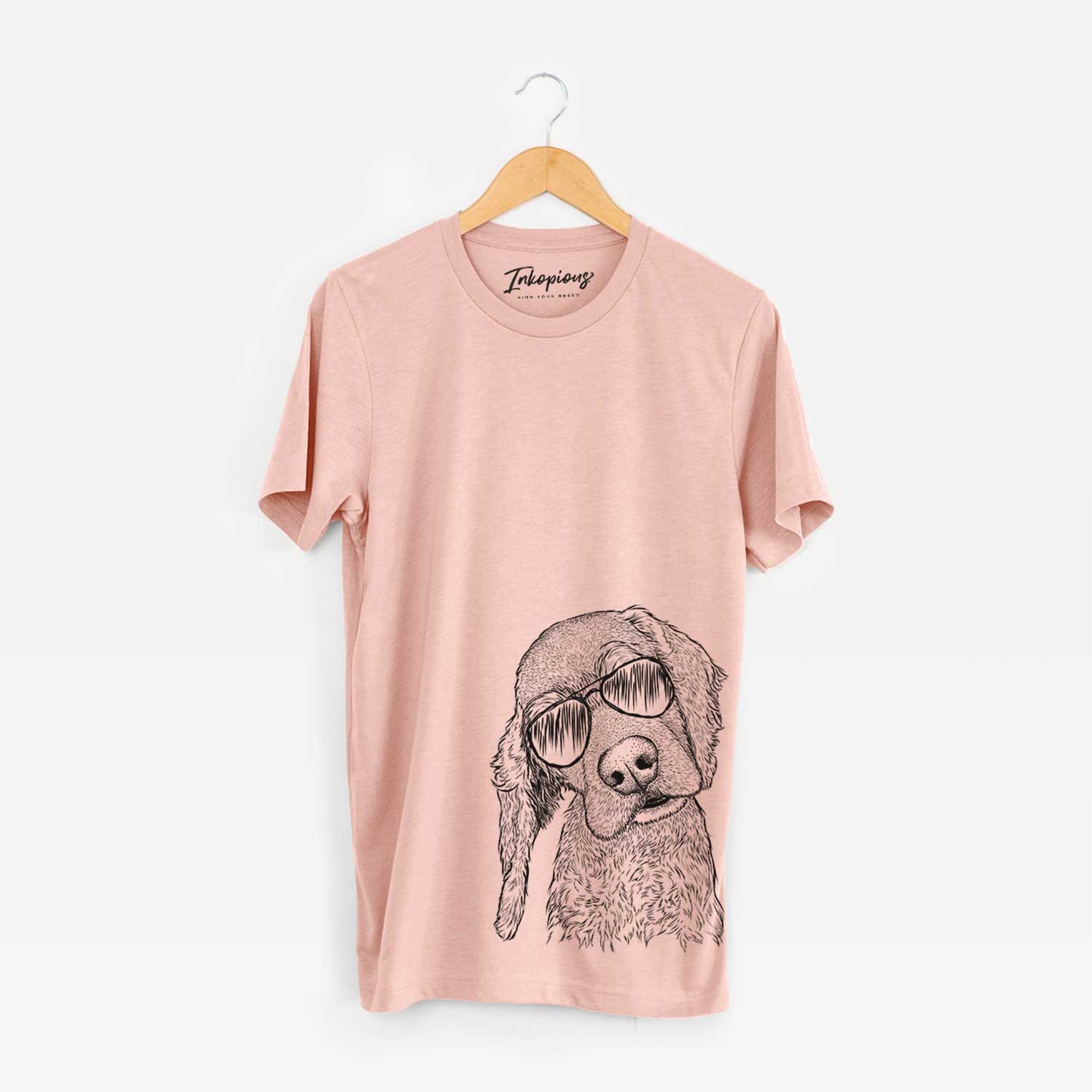 Hand-drawn sketch of Mambo #5 the Cocker Spaniel wearing aviator sunglasses on a Peach Bella Canvas Unisex Crewneck