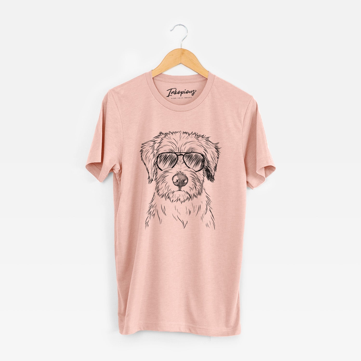 Hand-drawn sketch of Marek the Bernedoodle wearing aviator sunglasses on a Peach Unisex crewneck