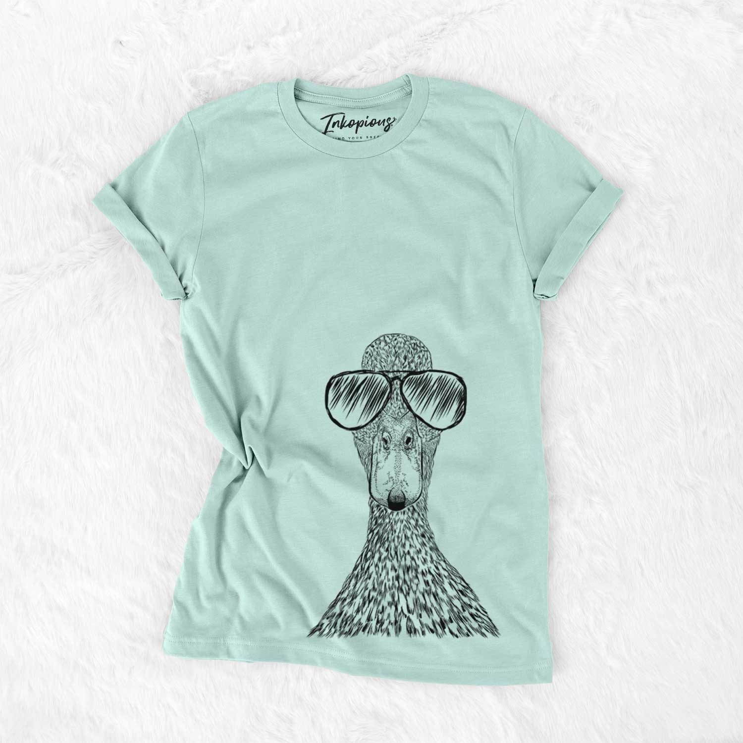 Hand-drawn sketch of Marge the Mallard Duck wearing aviator sunglasses on a Heather Sage Unisex crewneck