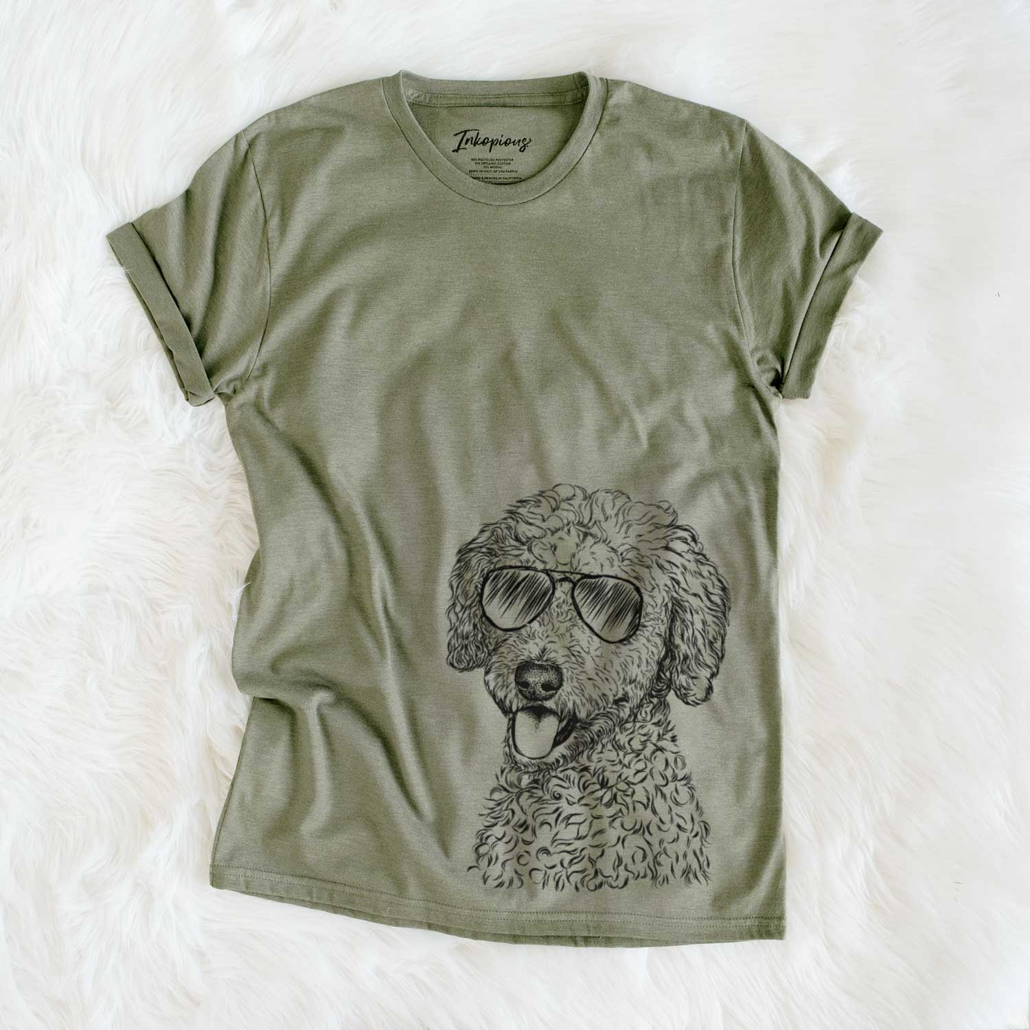 Hand-drawn sketch of Marlow the Goldendoodle wearing aviator sunglasses on an Olive Unisex crewneck