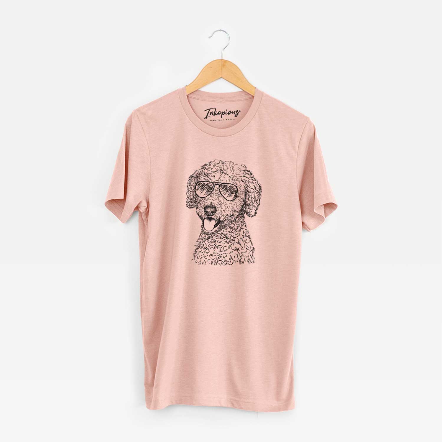 Hand-drawn sketch of Marlow the Goldendoodle wearing aviator sunglasses on a Peach Unisex crewneck