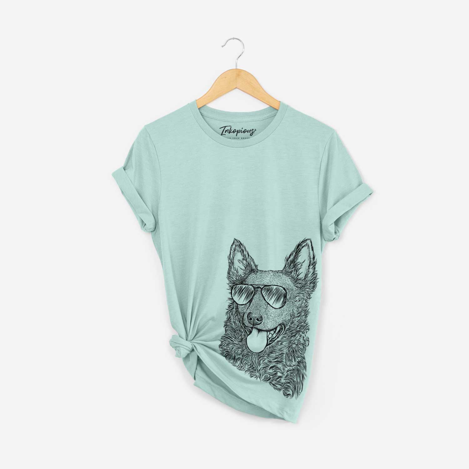 Hand-drawn sketch of Maximo the Mudi wearing aviator sunglasses on a Heather Sage Bella Canvas Unisex Crewneck