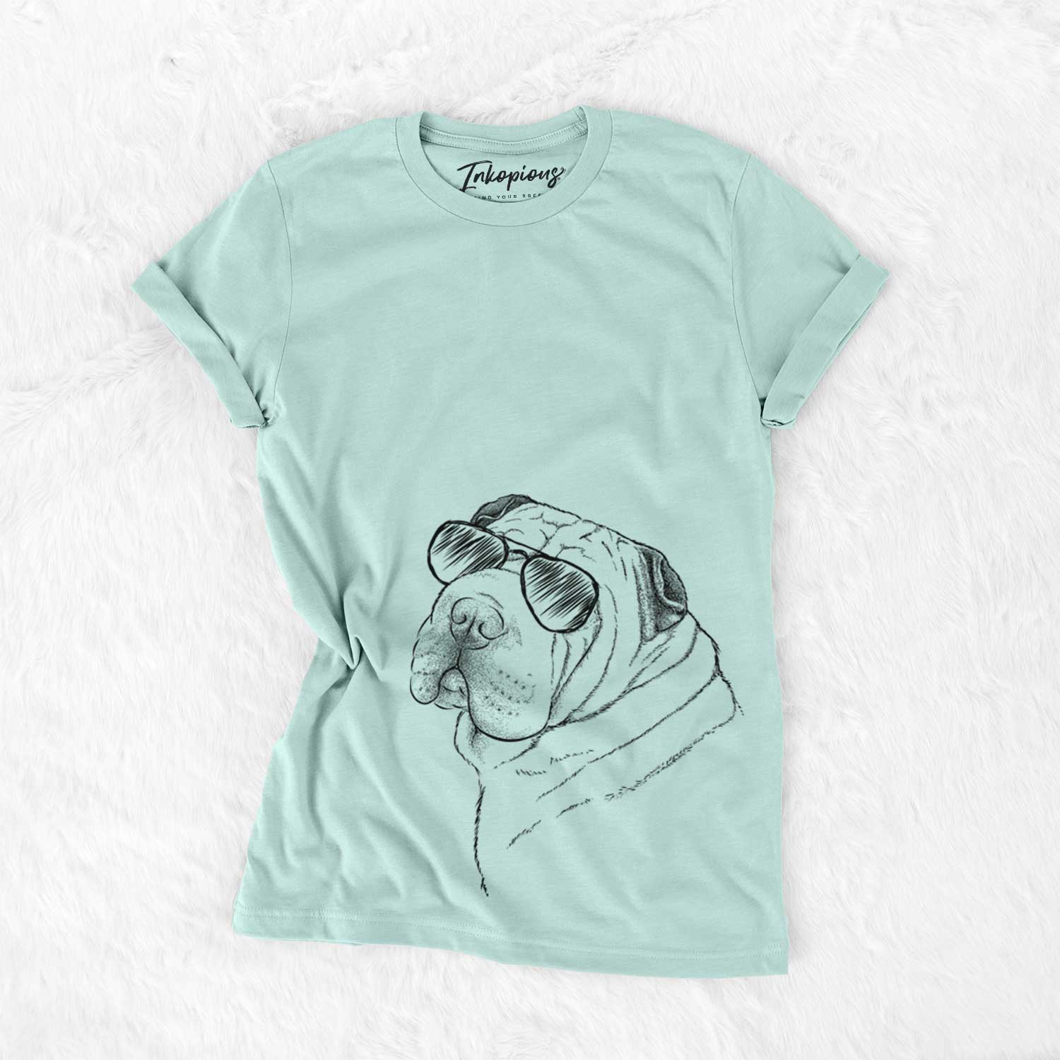 Hand-drawn sketch of Maximus the Shar Pei wearing aviator sunglasses on a Heather Sage Unisex crewneck