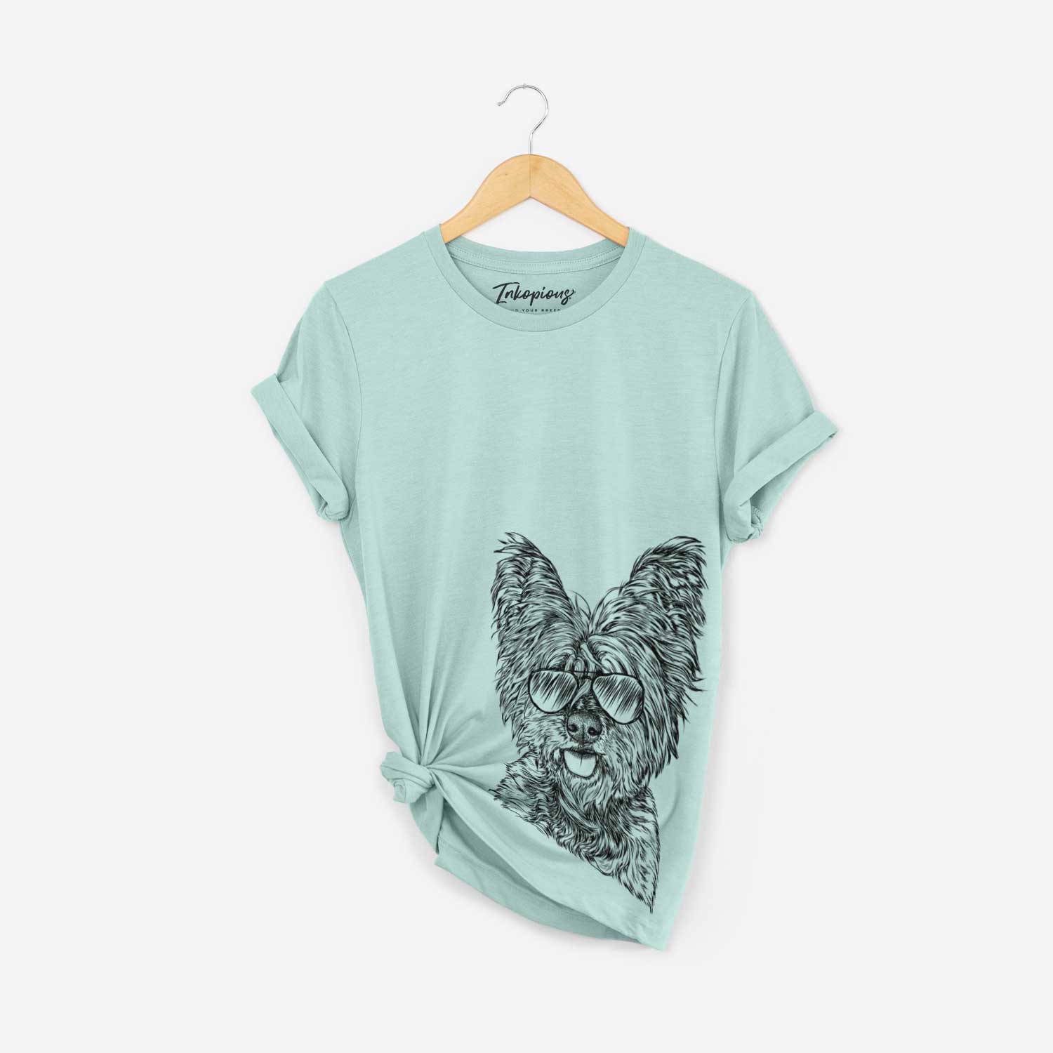 Hand-drawn sketch of McDuff the Cairn Terrier wearing aviator sunglasses on a Heather Sage Bella Canvas Unisex Crewneck