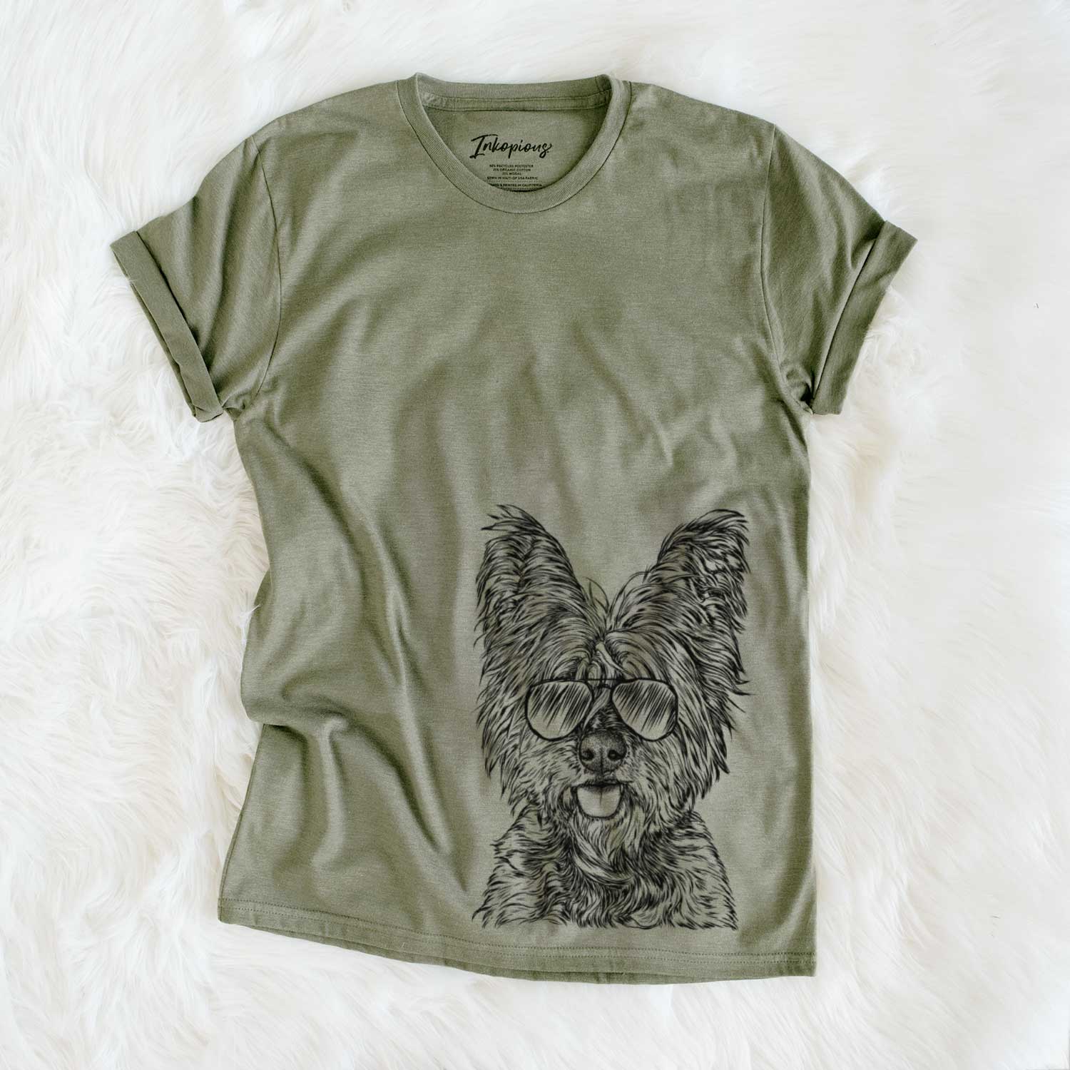 Hand-drawn sketch of McDuff the Cairn Terrier wearing aviator sunglasses on an Olive Unisex crewneck